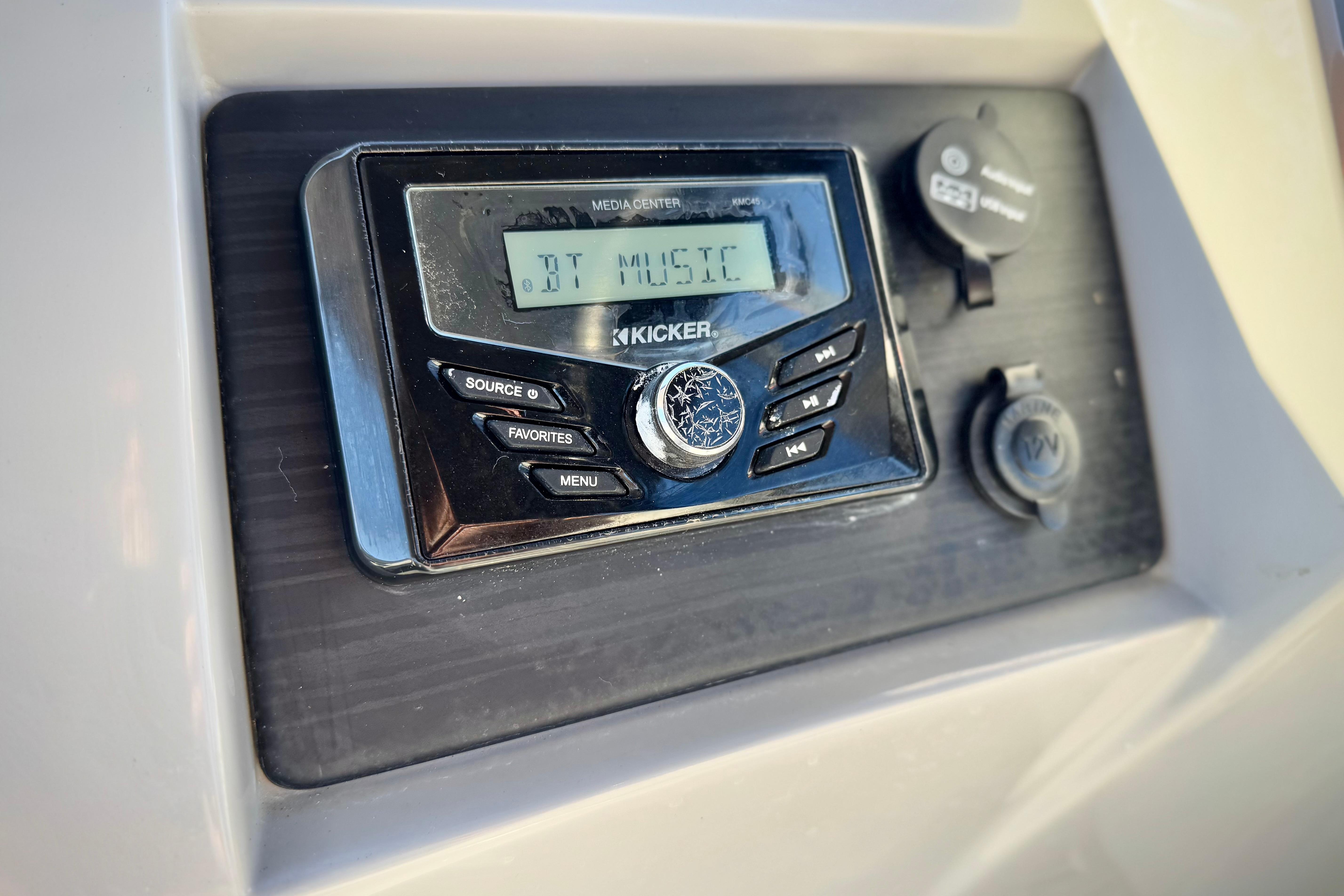 Kicker media center on 2021 Bennington 23LSR boat, displaying "BT MUSIC".