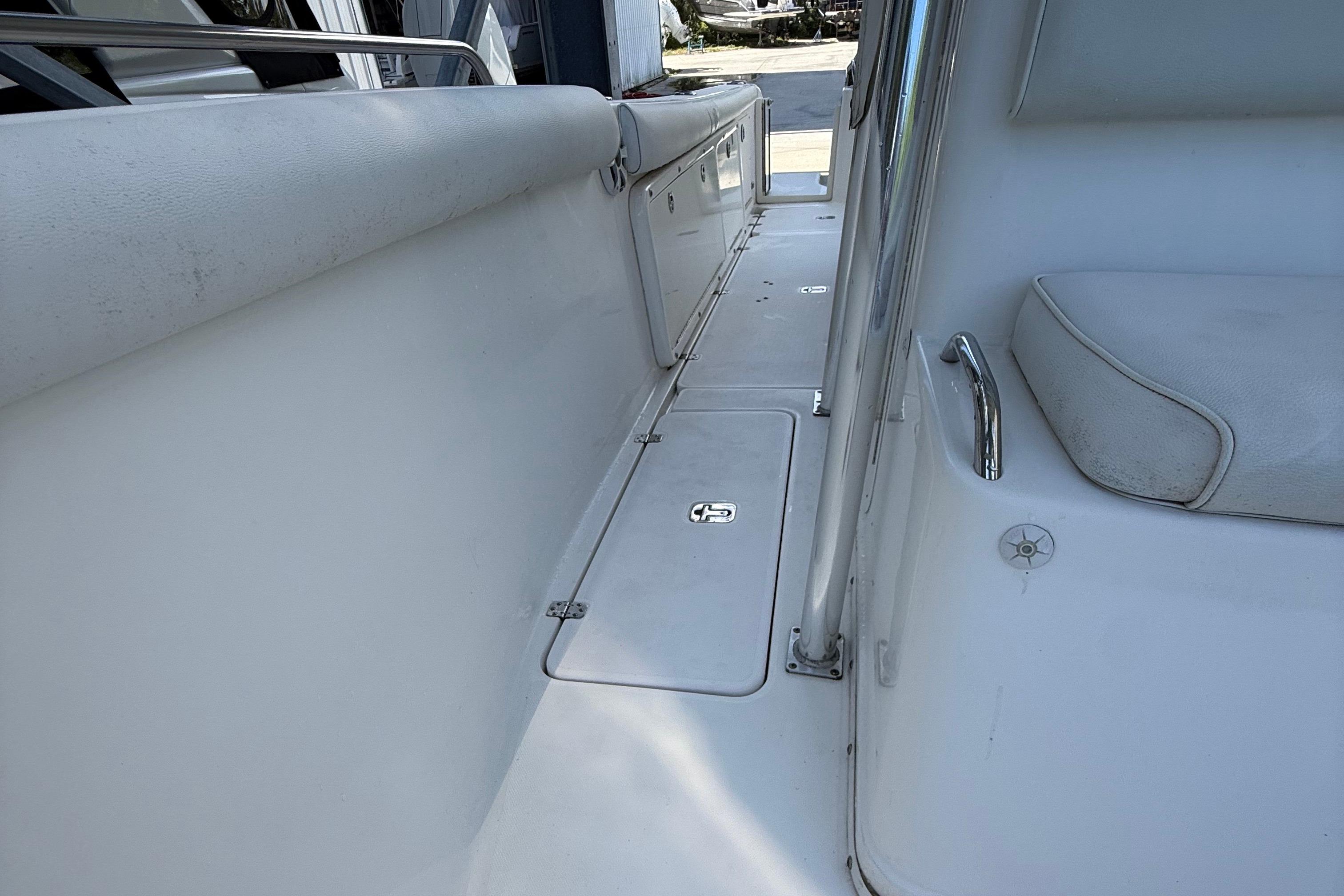 2008 Century 2901 Center Console boat interior with seating and storage compartments.