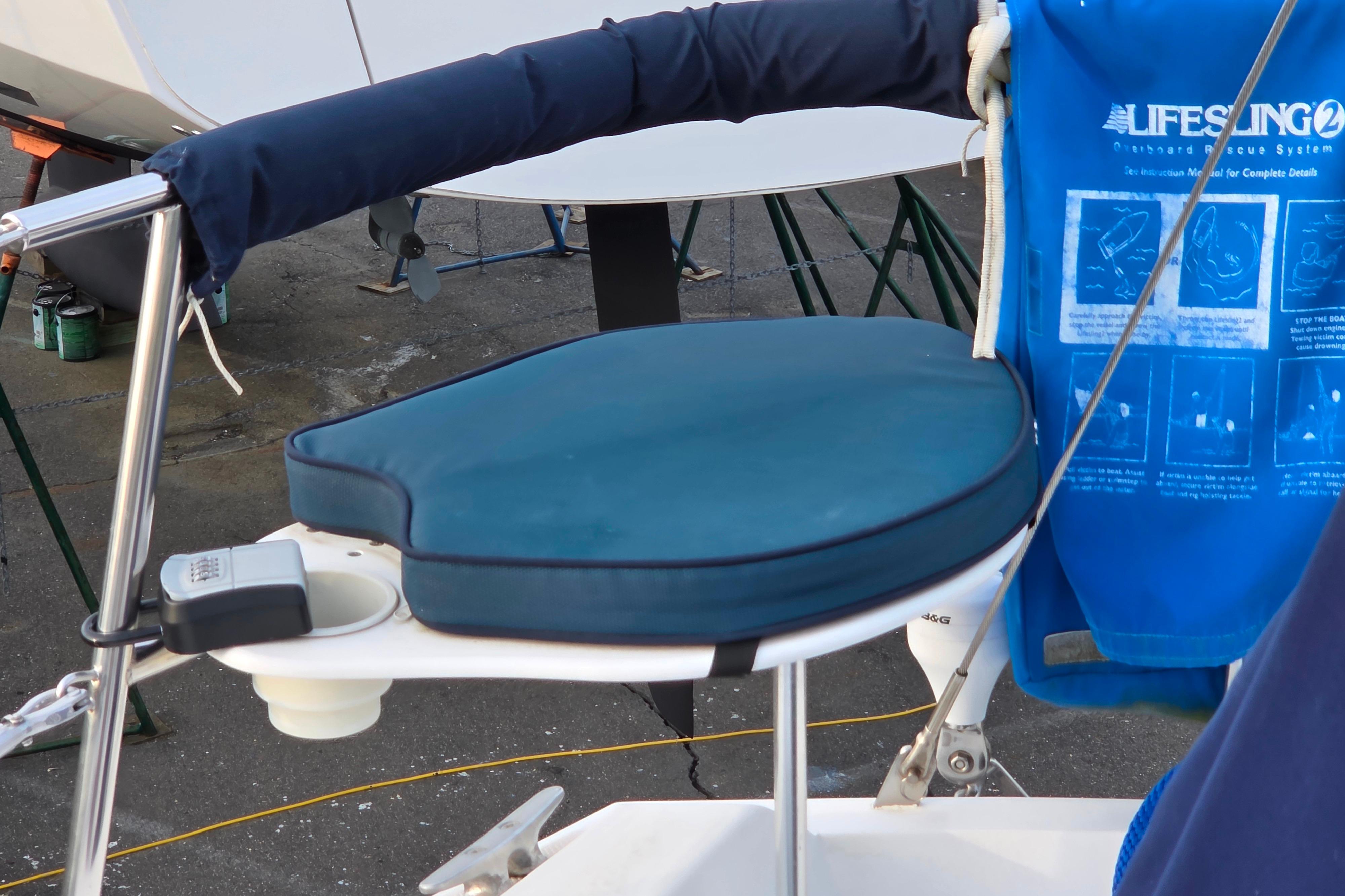 Catalina 355 sailboat cockpit seat with blue cushion and Lifesling rescue system.