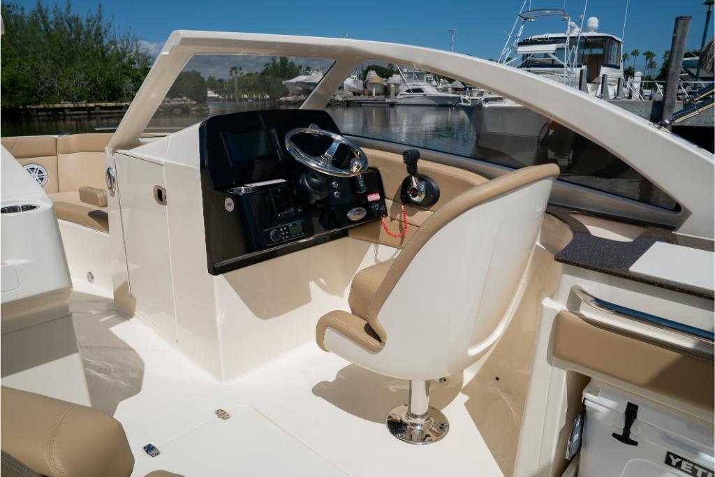 2023 Scout 240 Dorado boat interior with steering wheel and controls.