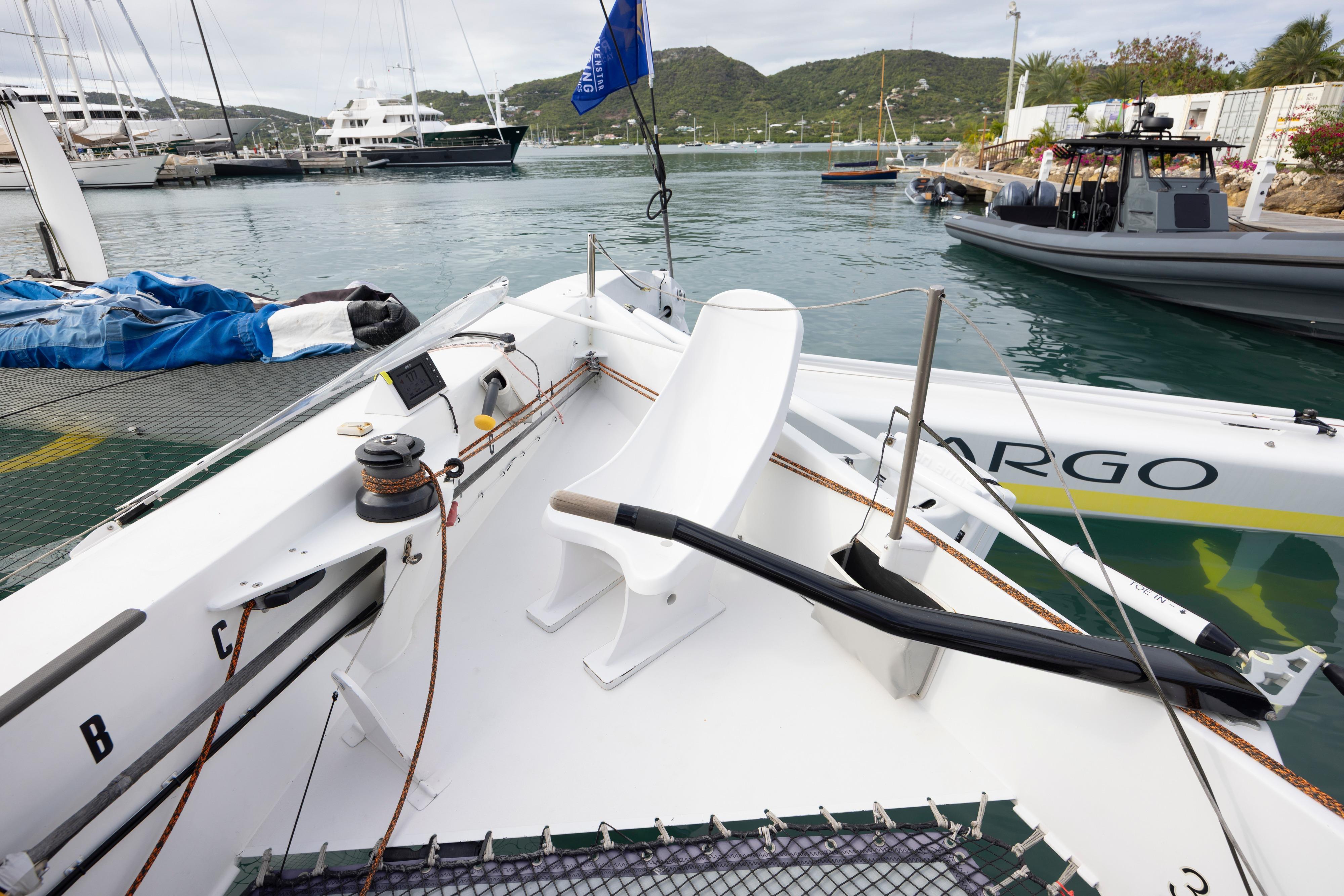 Sailing yacht MOD 70 by CDK Technologies, docked in a marina, 2012 model.