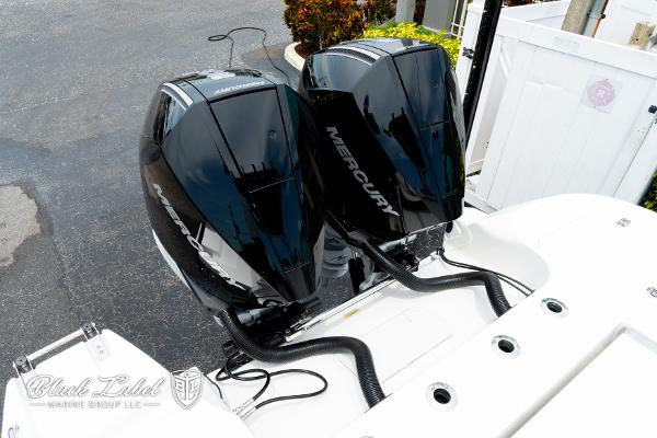 2025 Caymas 281 HB boat with dual Mercury outboard engines.