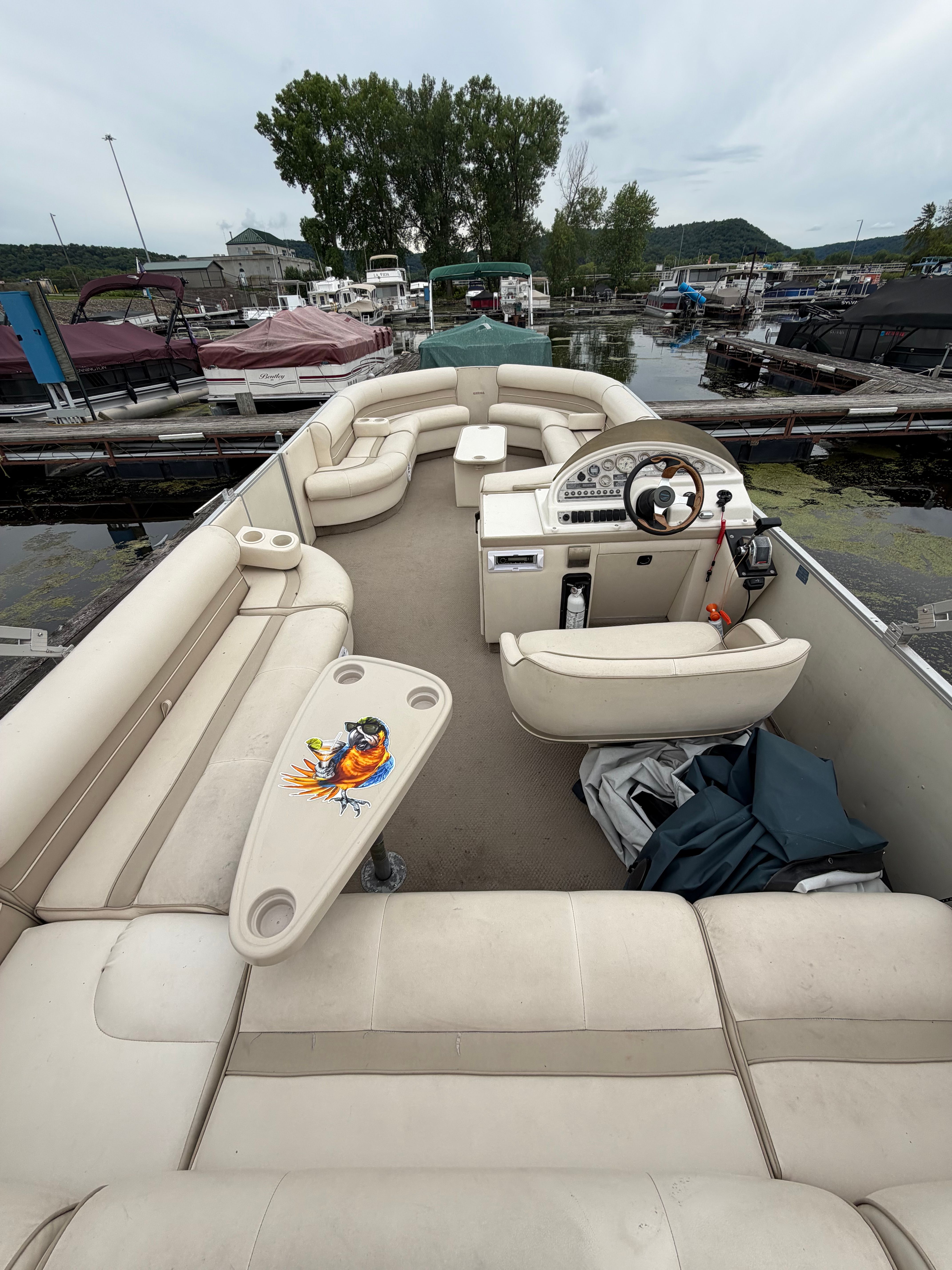 2000 Crest Grand Caribbean pontoon boat with spacious deck and comfortable seating.