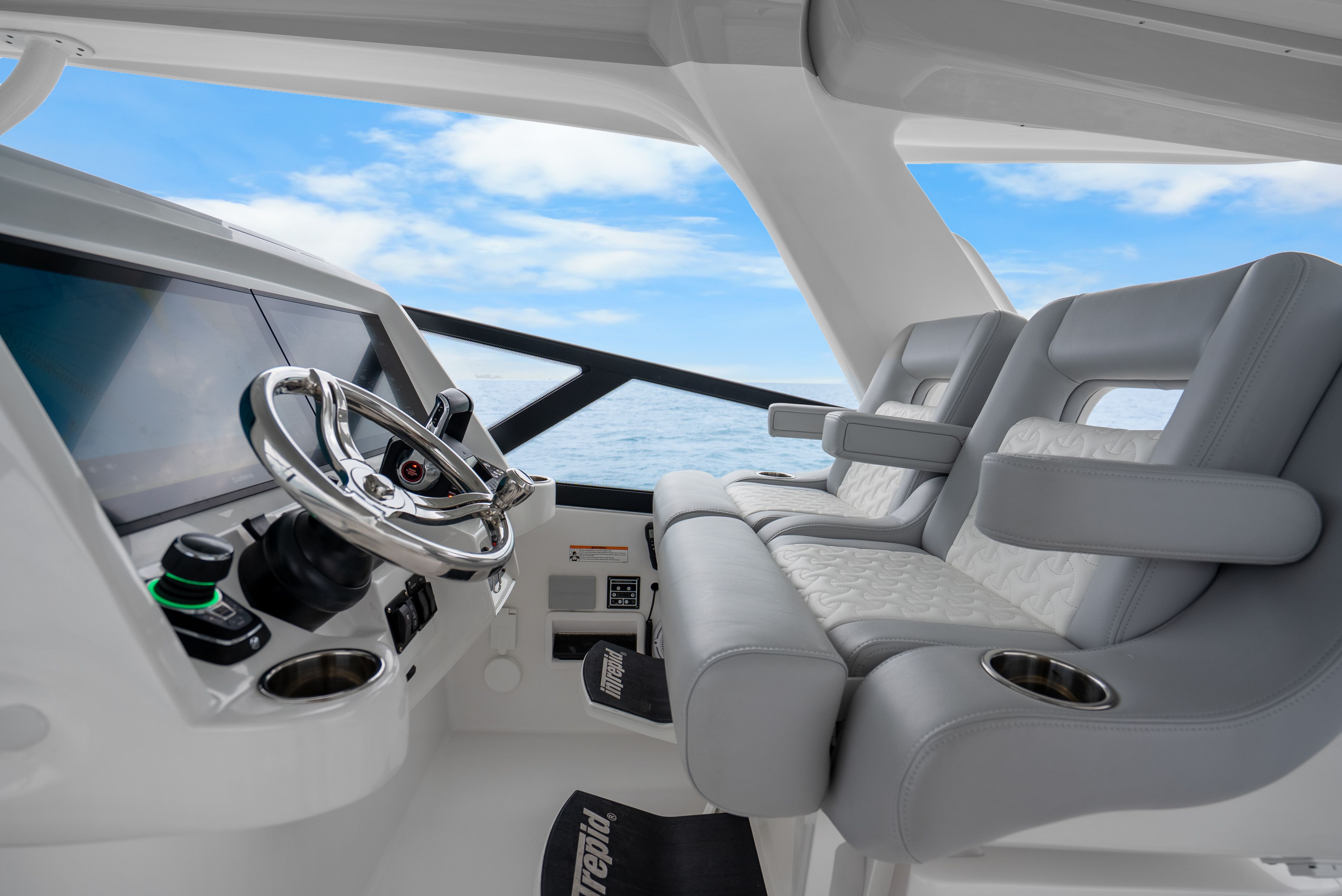 Interior of 2024 Intrepid 477 Evolution with modern helm station.
