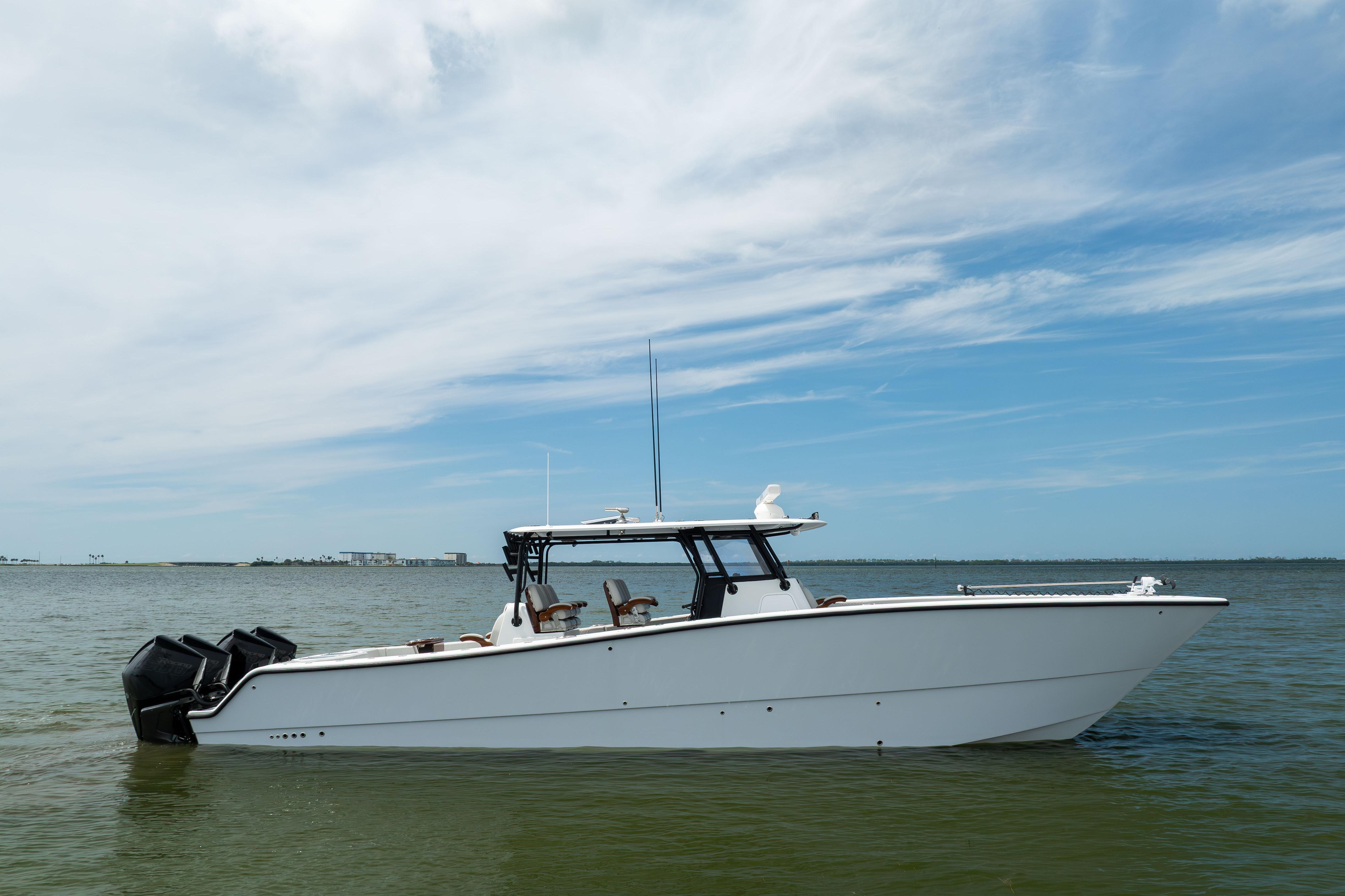 2025 Freeman 42 LR boat on calm water under a partly cloudy sky.