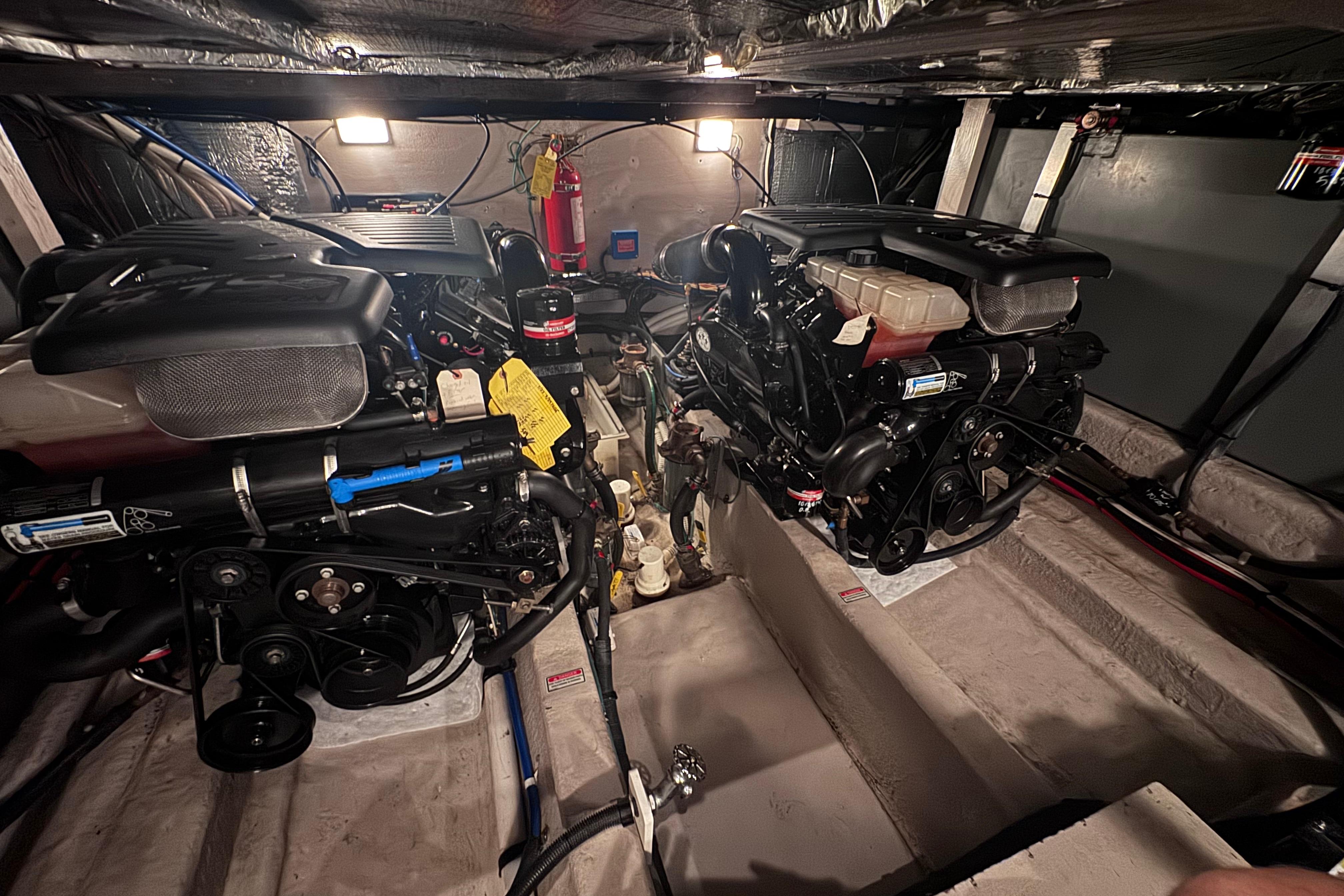 Engine room of a 2004 Sea Ray 390 Motor Yacht, featuring dual engines and equipment.