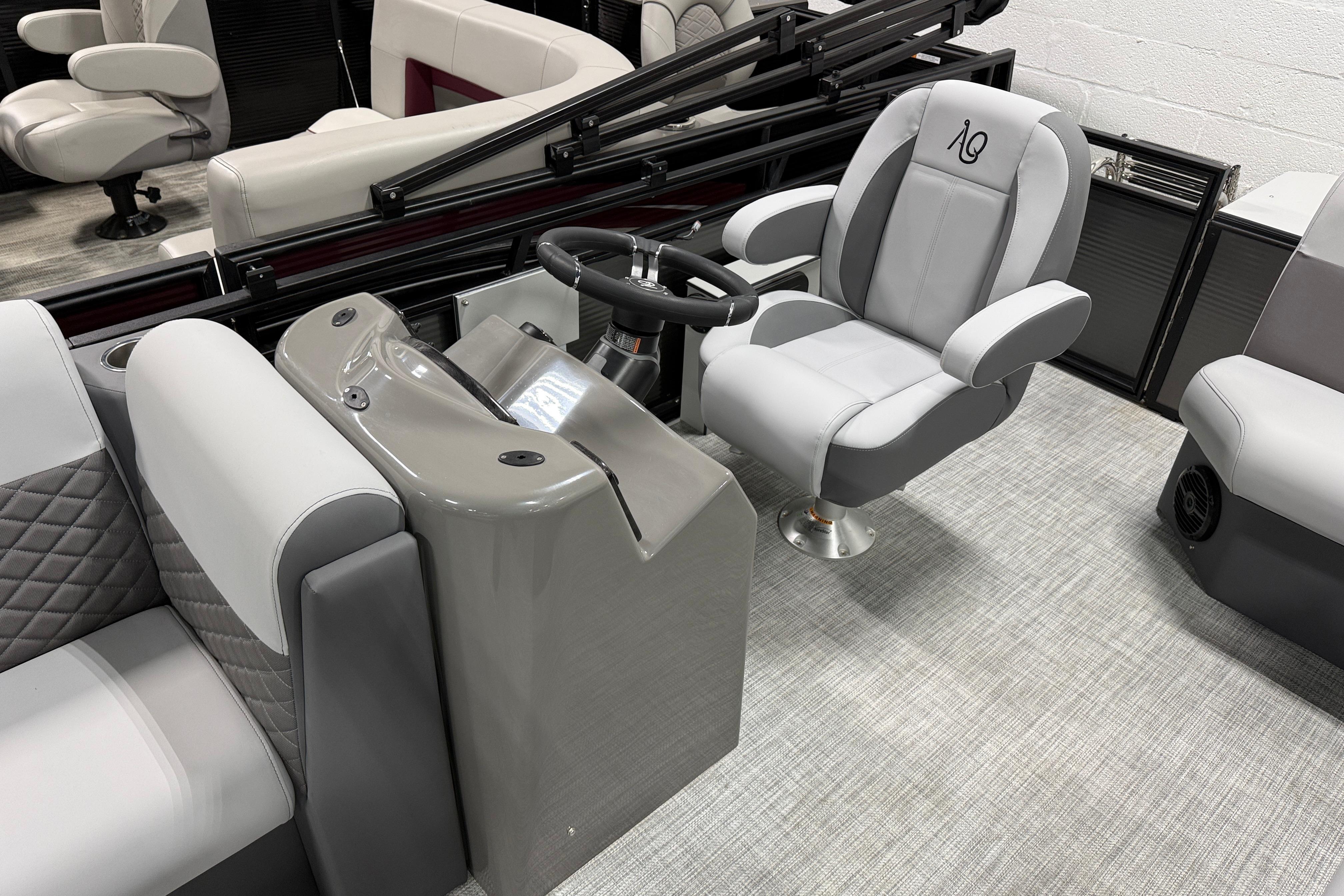 2026 Angler Quest 818 Panfish Cruise boat interior with modern seating and steering console.