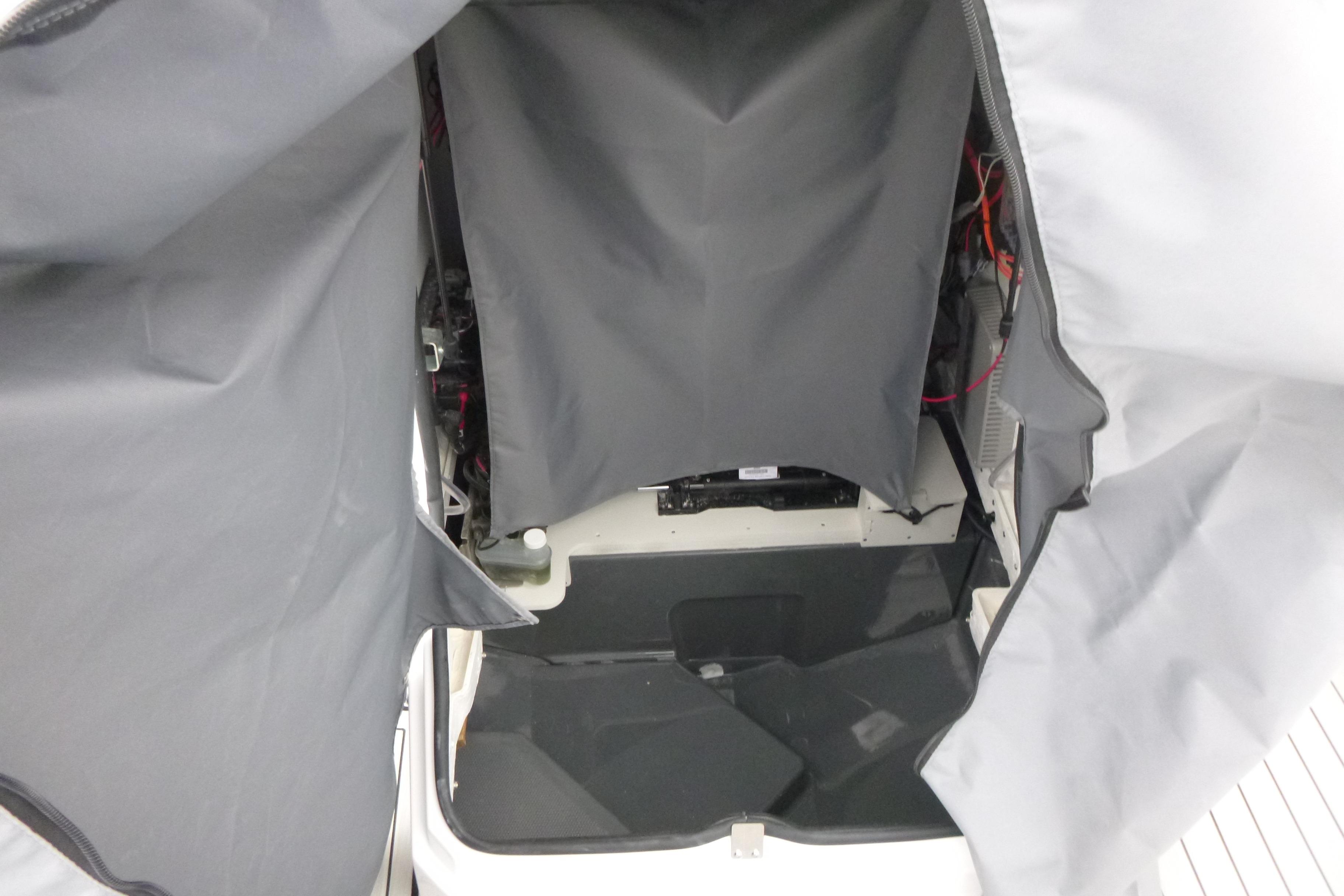Interior view of 2026 Yamaha Boats 255 FSH Sport H, showcasing storage compartment.