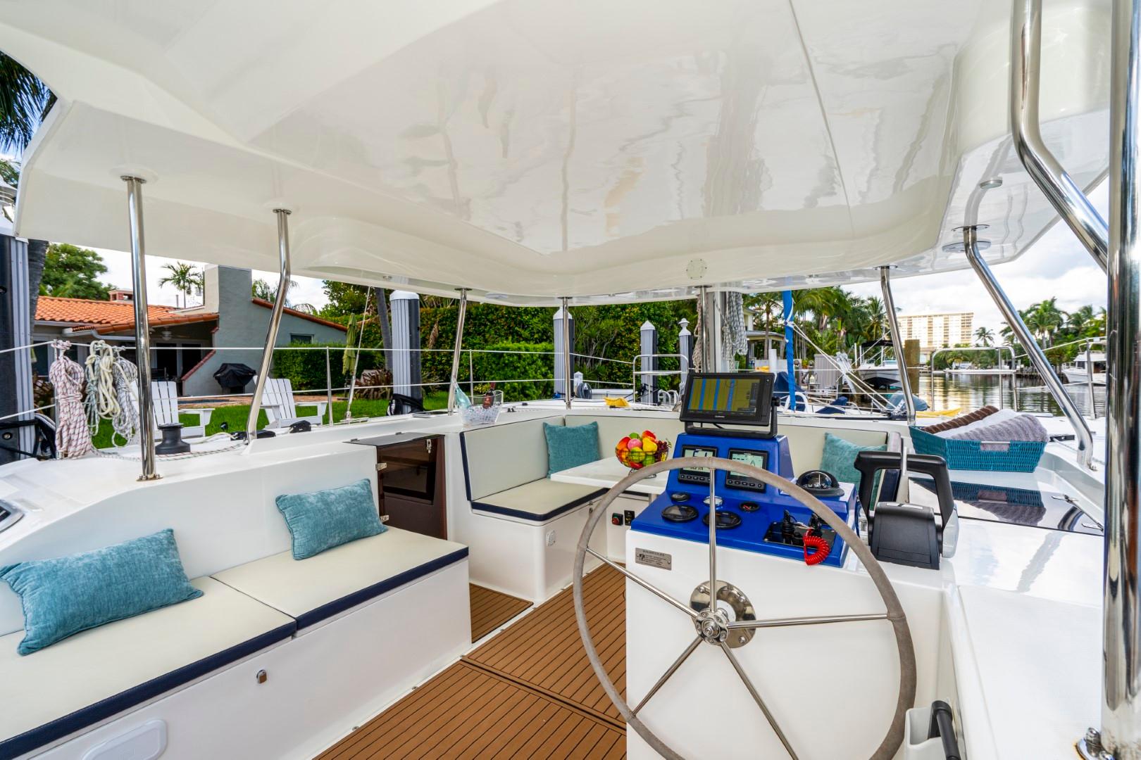 Luxurious 2025 Smart Cat E280 Electric yacht interior with modern seating and navigation equipment.