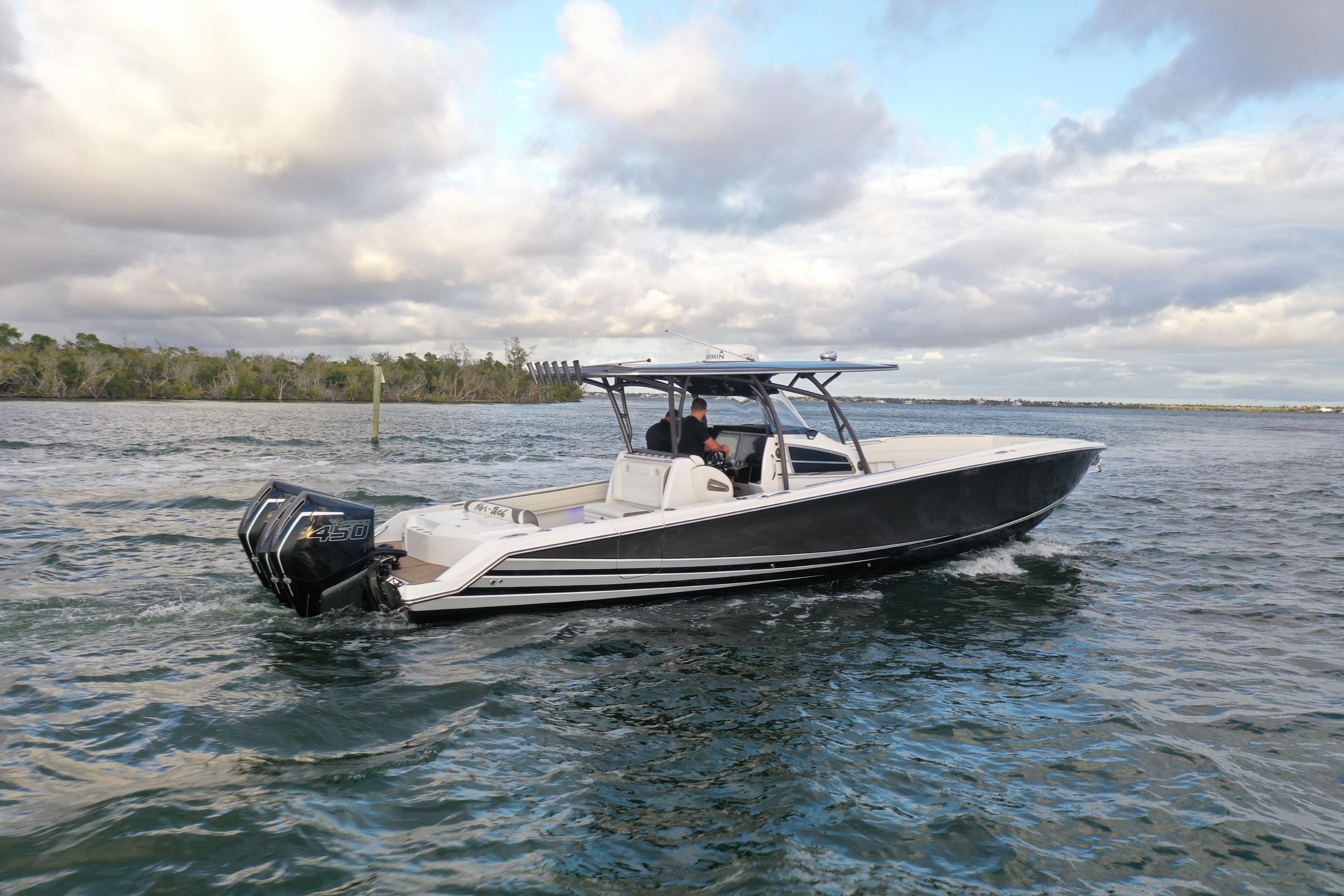 2021 Nor-Tech 390 Sport Center Console boat cruising on open water.