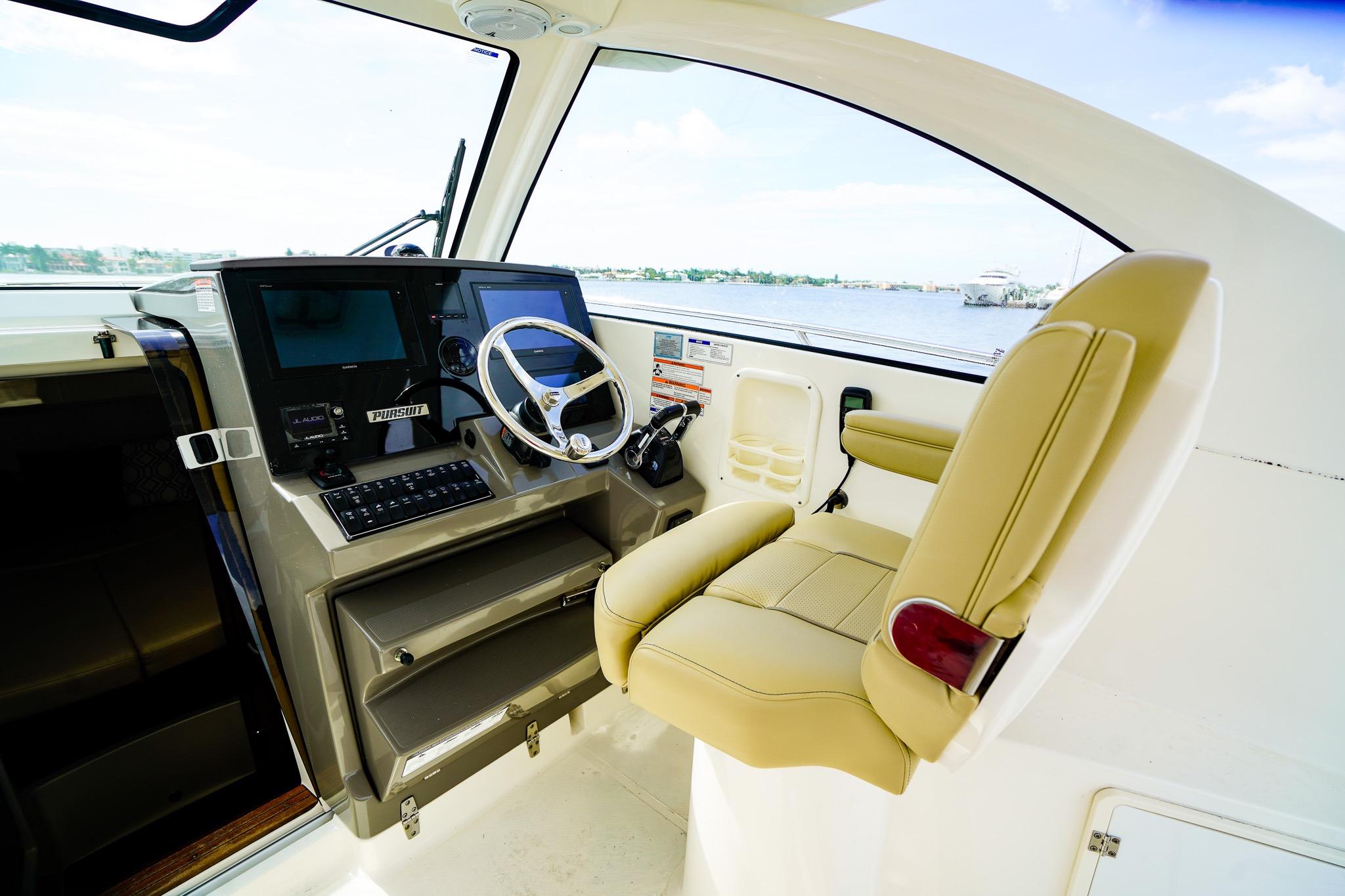 2020 Pursuit OS 325 Offshore helm with modern controls and comfortable seating.