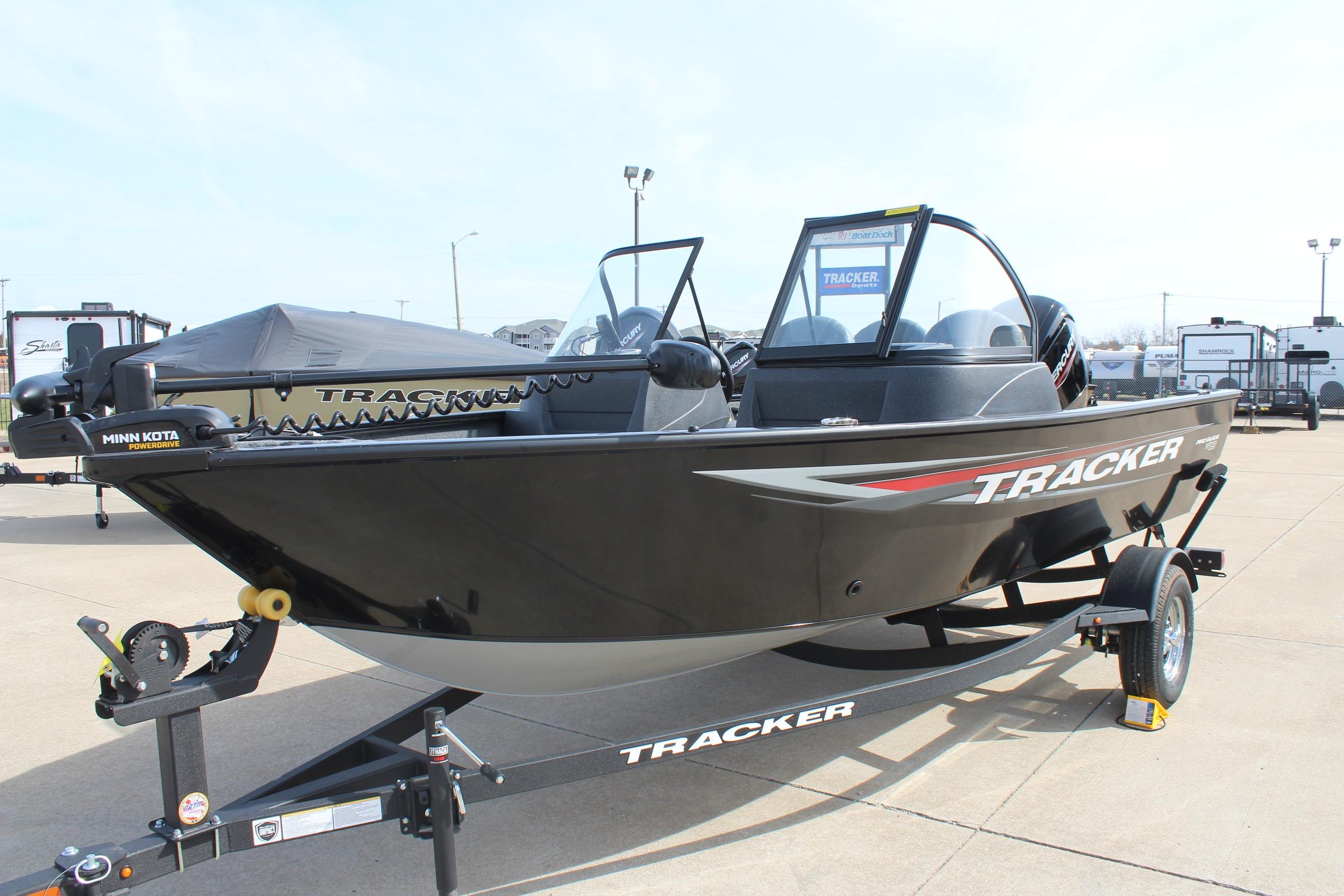 2026 Tracker Pro Guide V-16 WT boat on trailer, displayed outdoors.