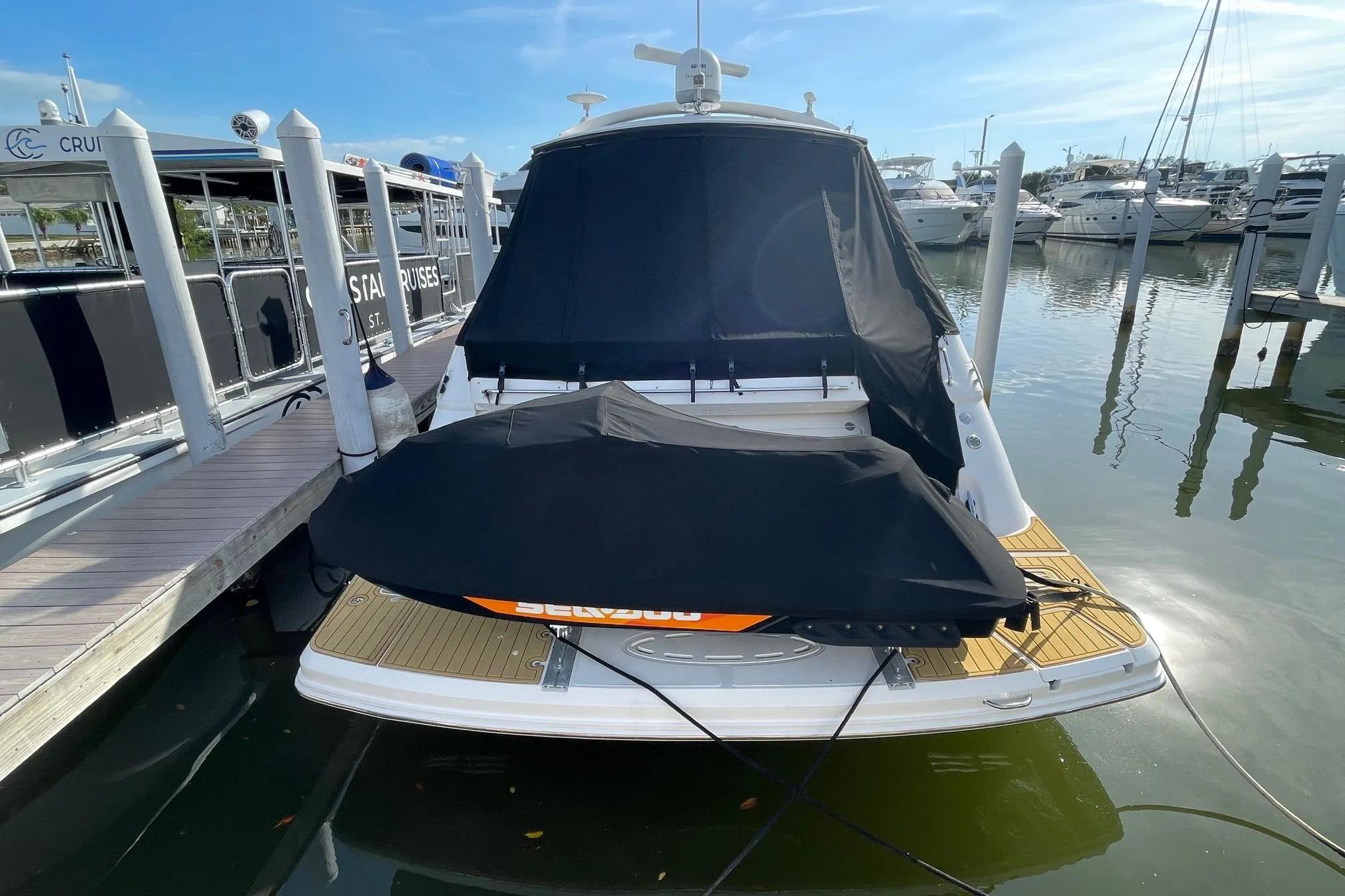 2016 Sea Ray Sundancer 510 yacht docked at marina, covered and ready for cruising.