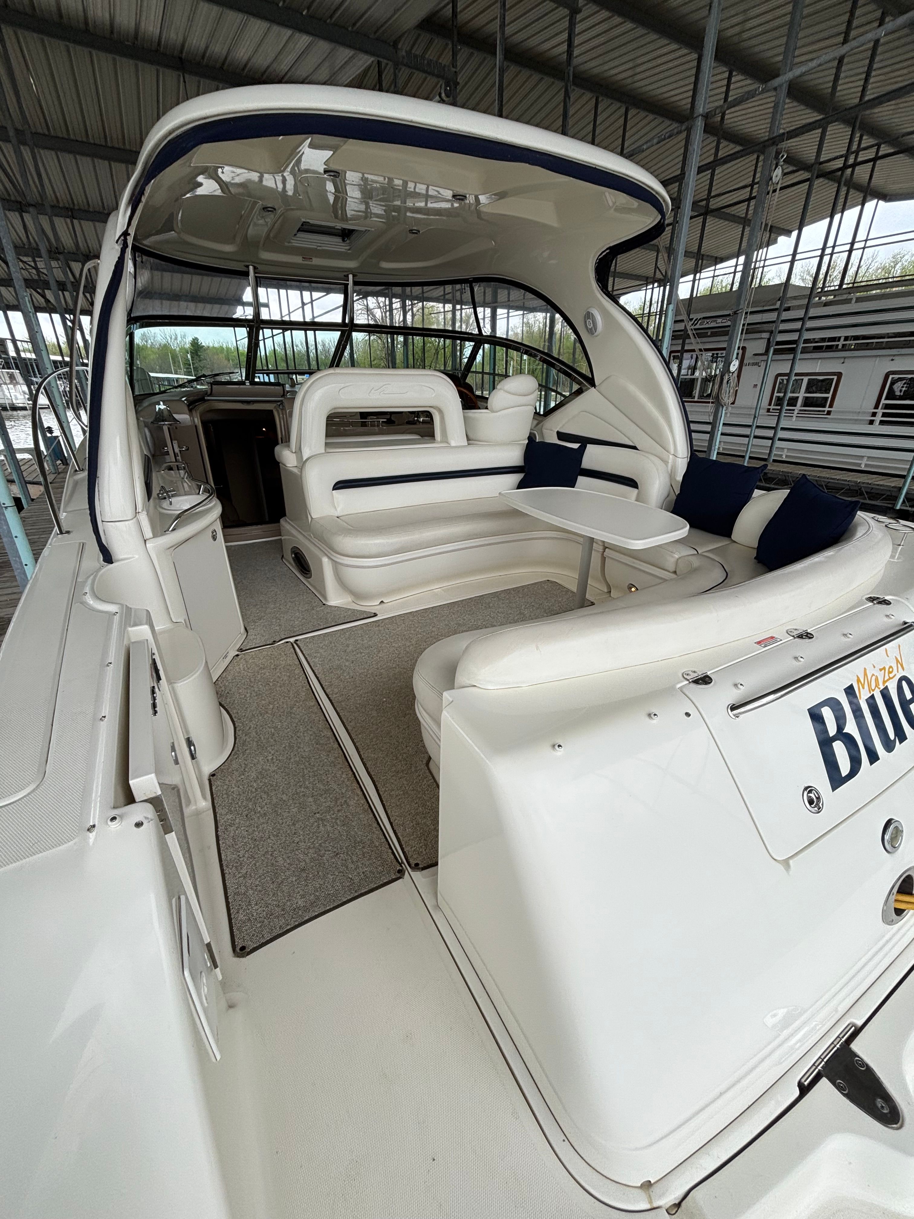 Interior of a 2004 Sea Ray 420 Sundancer yacht with seating area.