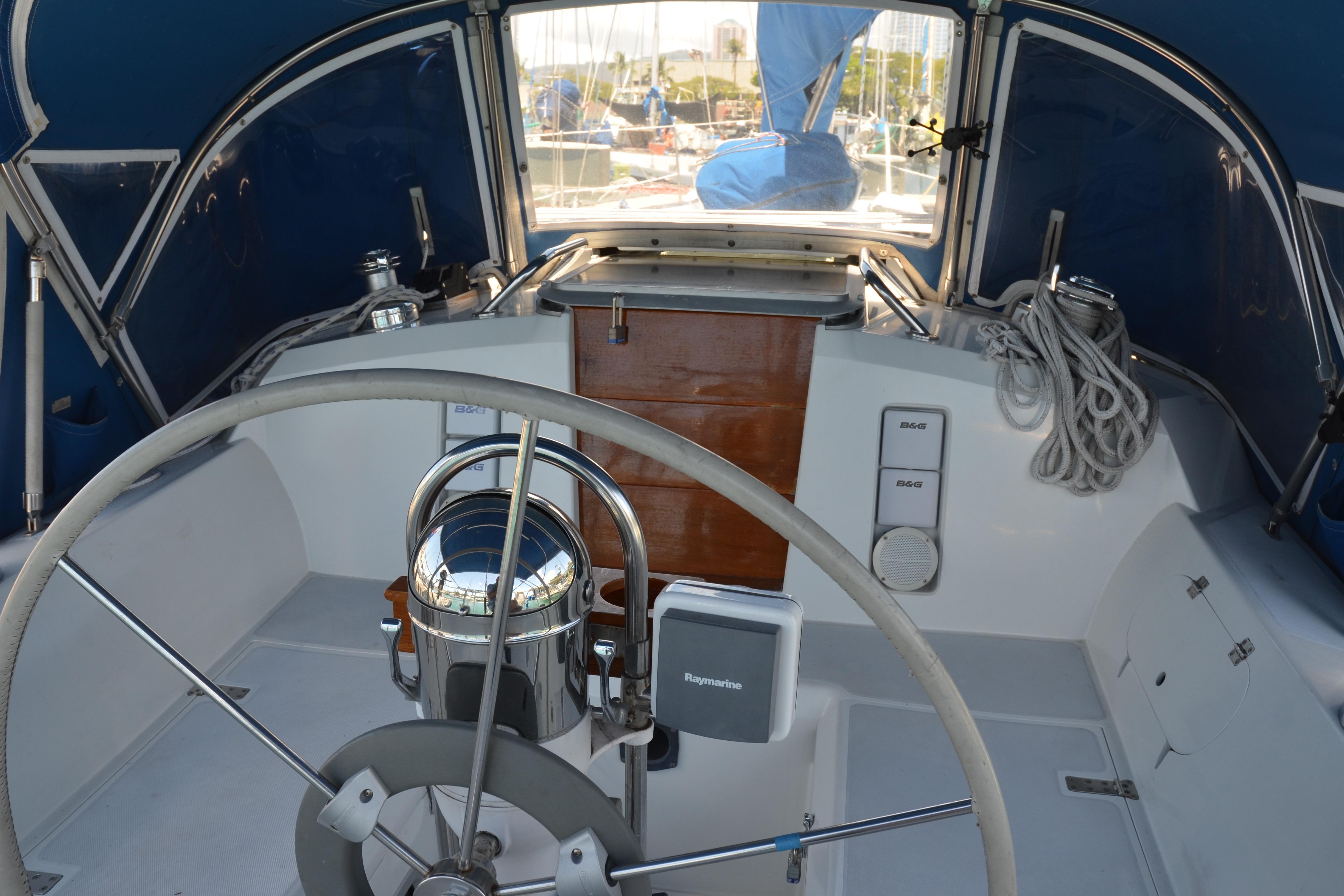 Cockpit of 1987 Norseman 400 sailboat with steering wheel and navigation equipment.