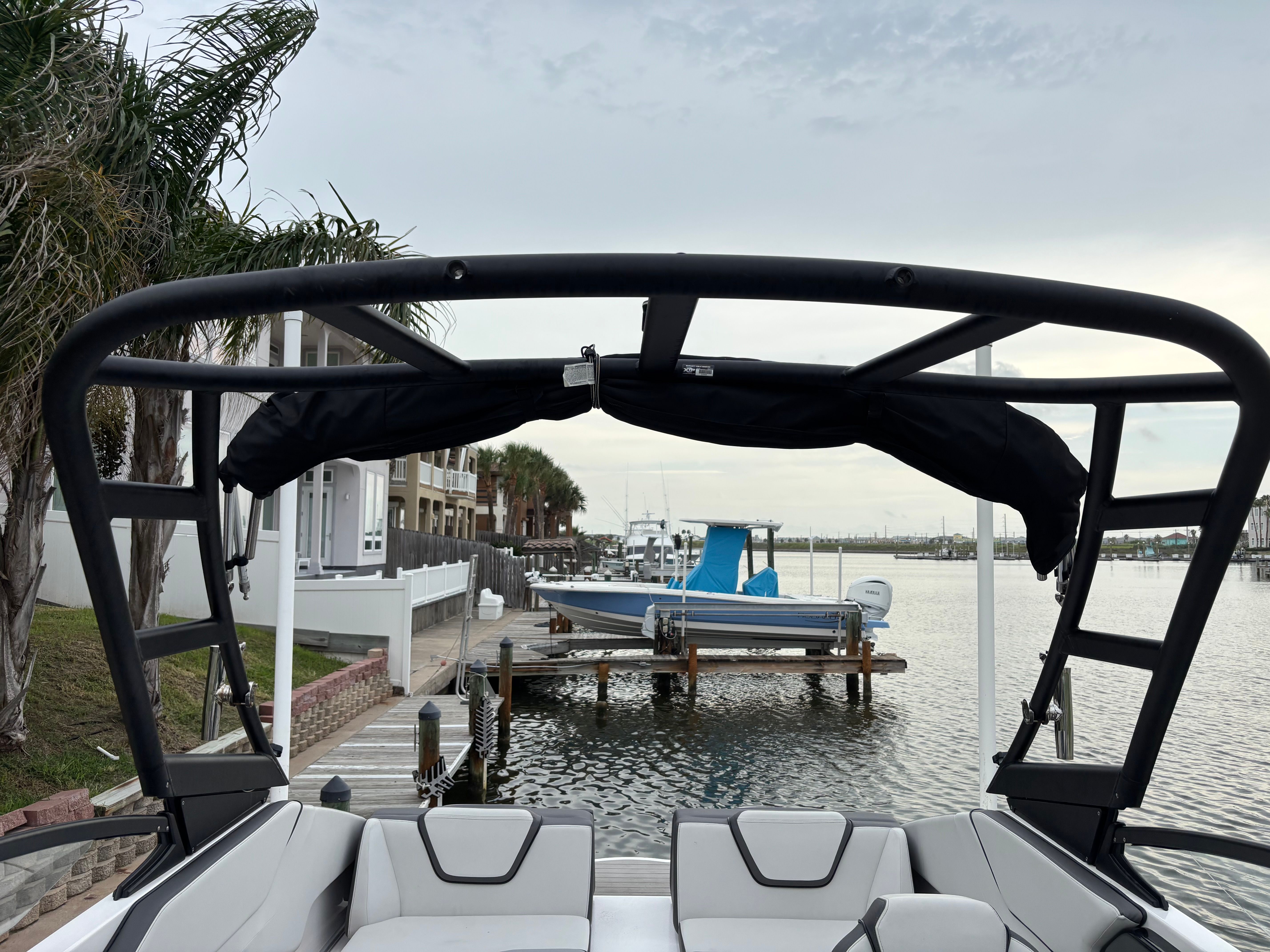 A Yamaha AR250 boat docked with a view of the water.