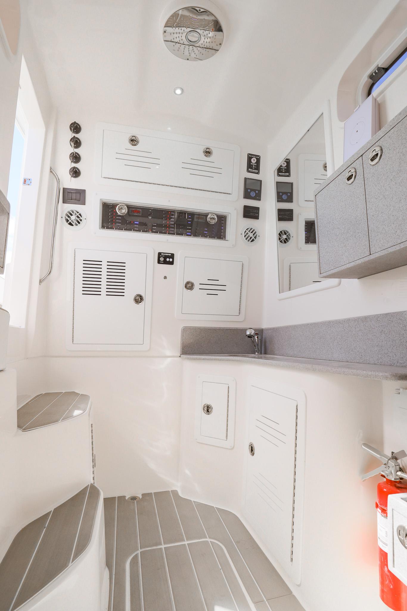 2025 Blackwater 43 Sportfish interior with control panels and storage cabinets.