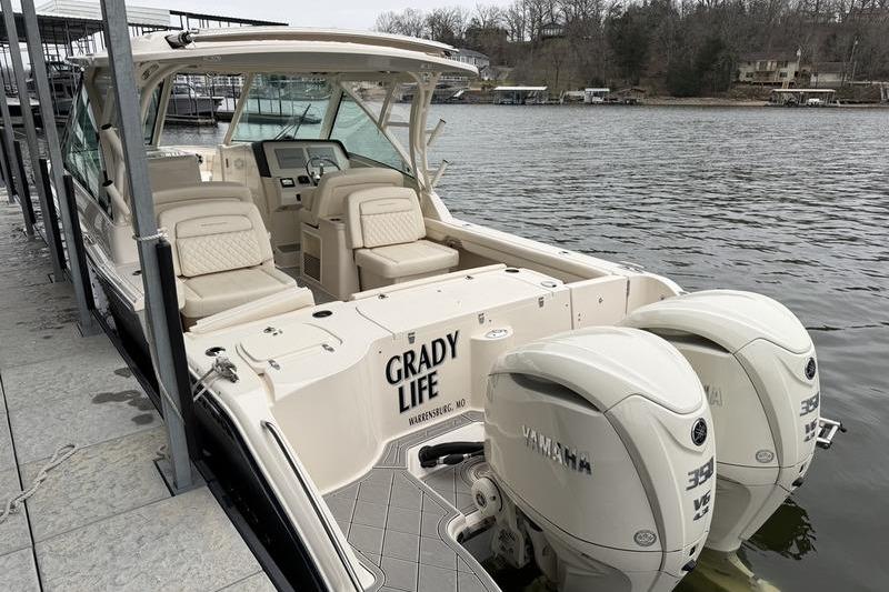 2025 Grady-White Freedom 325 boat docked with twin Yamaha engines.