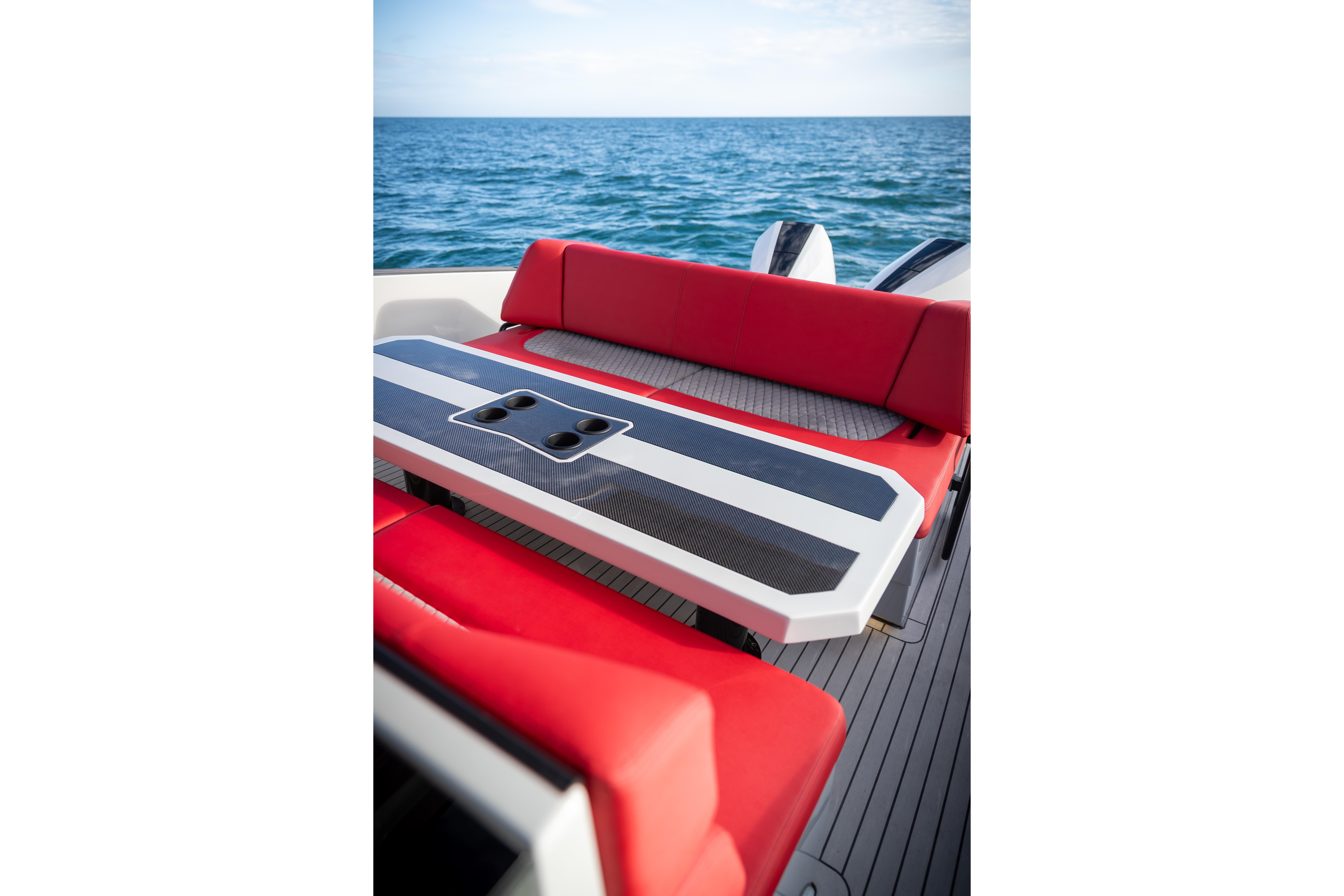 Tesoro 40 GTS 2026 with red seating area and ocean view.