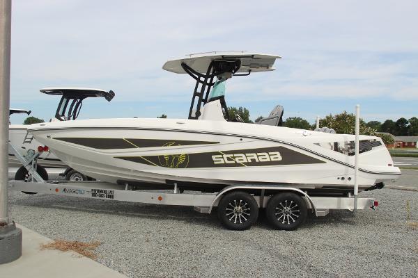2023 Scarab 255 Open ID boat on trailer, side view.