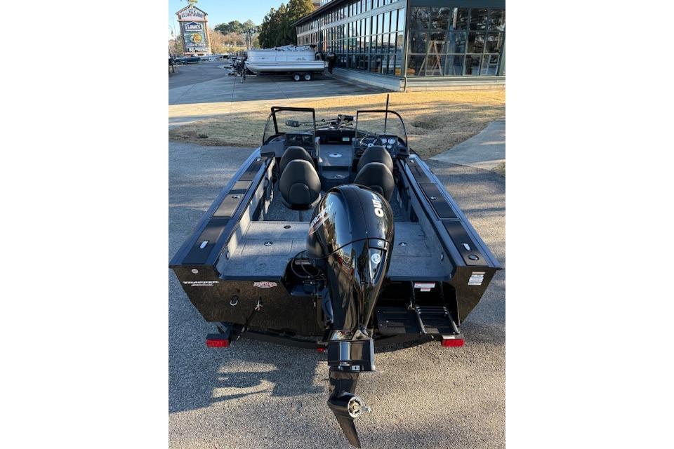 2026 Tracker Targa V-18 WT boat with outboard motor, parked outdoors.