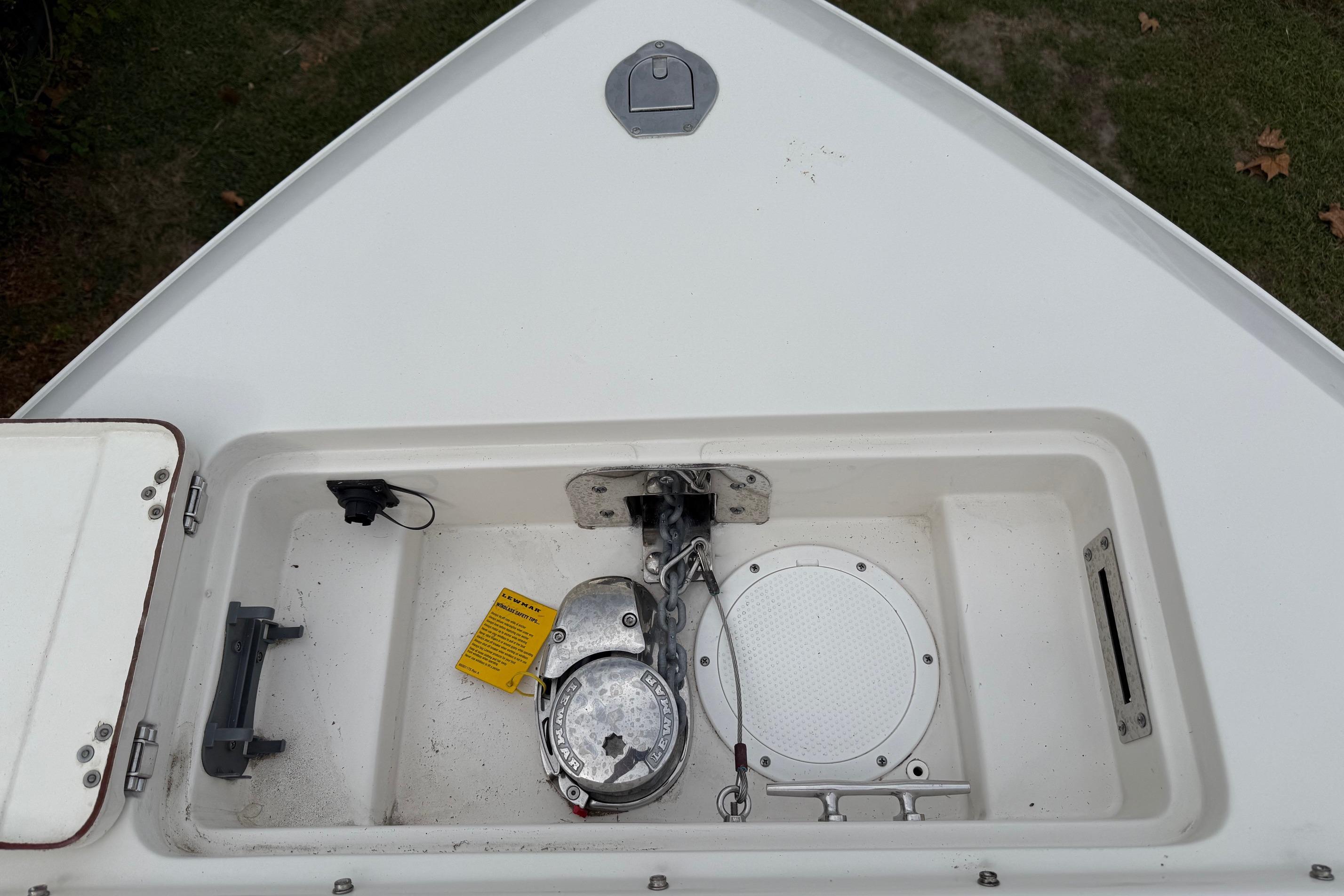 2019 Sailfish 275 DC boat anchor compartment with winch and cleat.