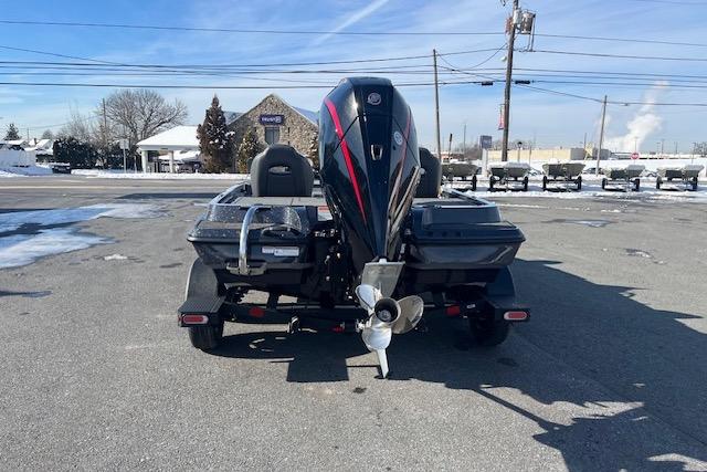 2026 Nitro Z19 XL Pro boat, rear view, parked on snowy pavement.