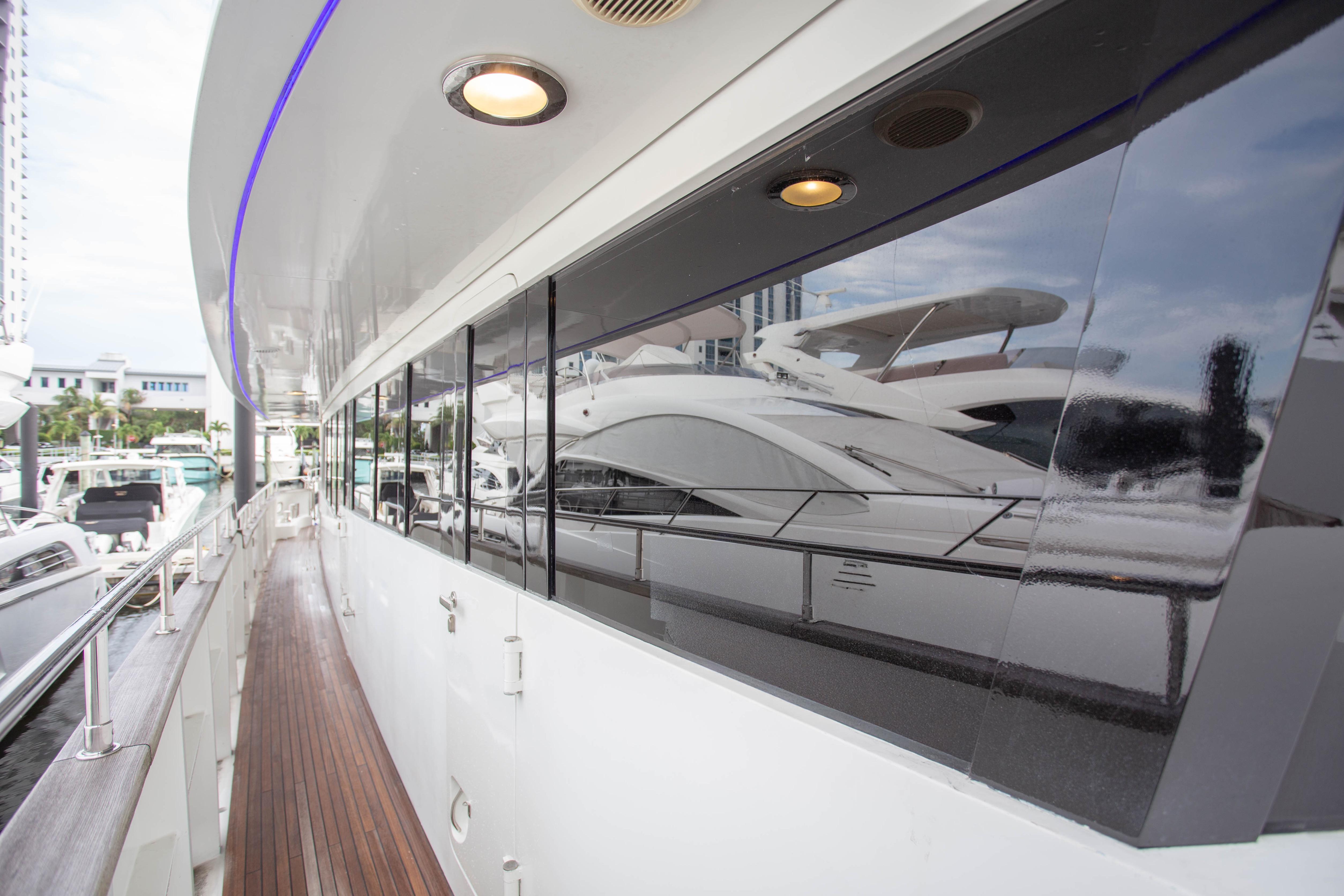 Side view of 2014 Fifth Ocean Yachts 24m Displacement Explorer Yacht at marina.