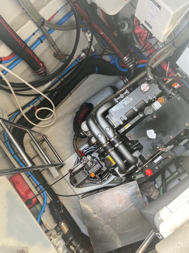 Engine room of a 2016 Lagoon 52 F catamaran, showcasing mechanical components and wiring.