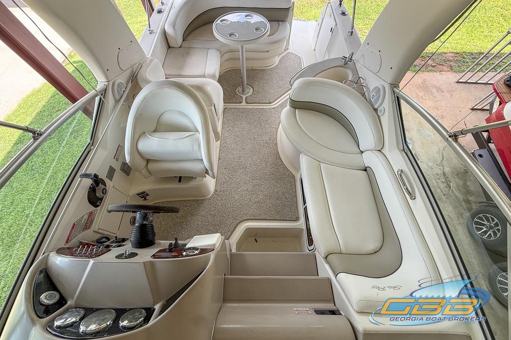 Interior of 2006 Sea Ray Sundancer 260 boat with seating and helm.