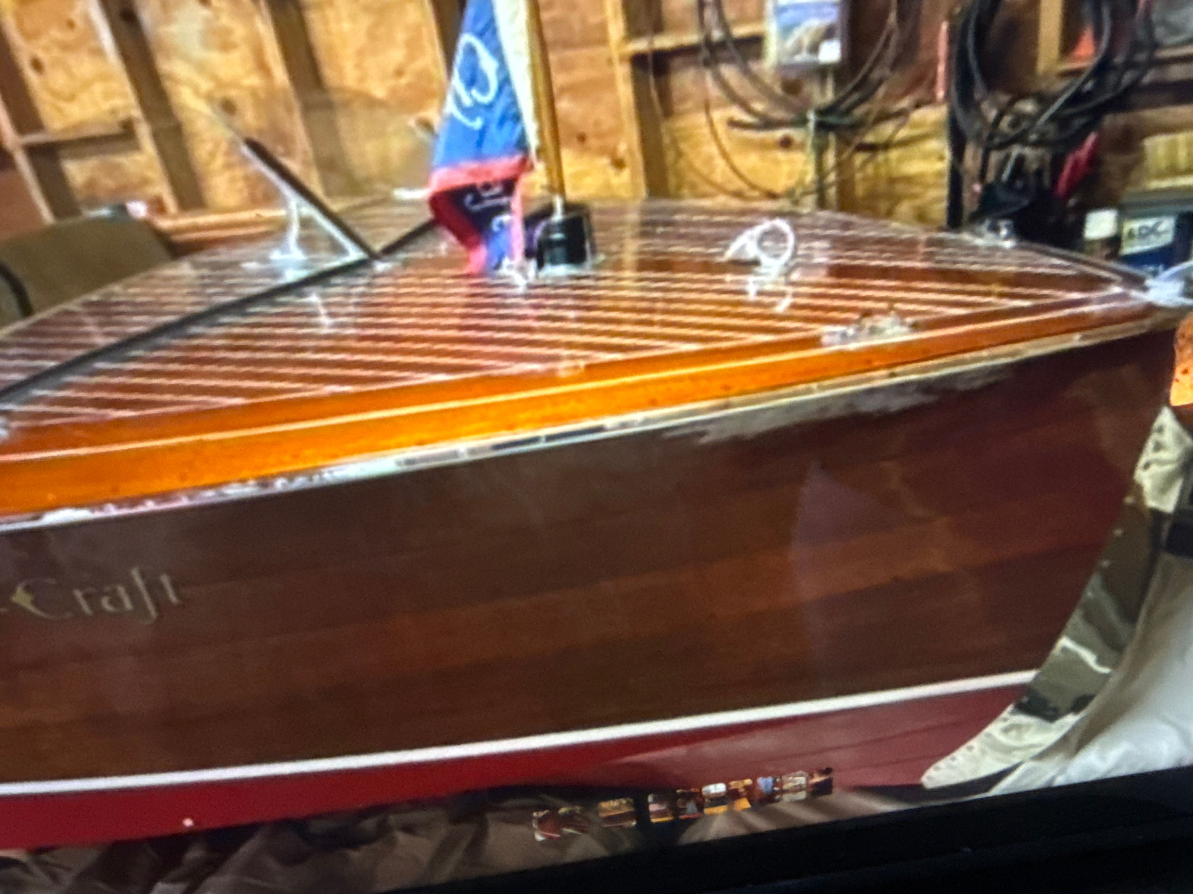 1940 Chris-Craft Barrelback boat in a workshop.