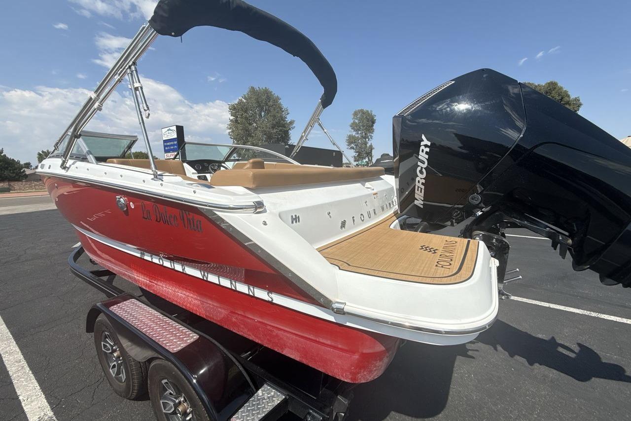 2024 Four Winns H1 OB boat with Mercury outboard engine on trailer.