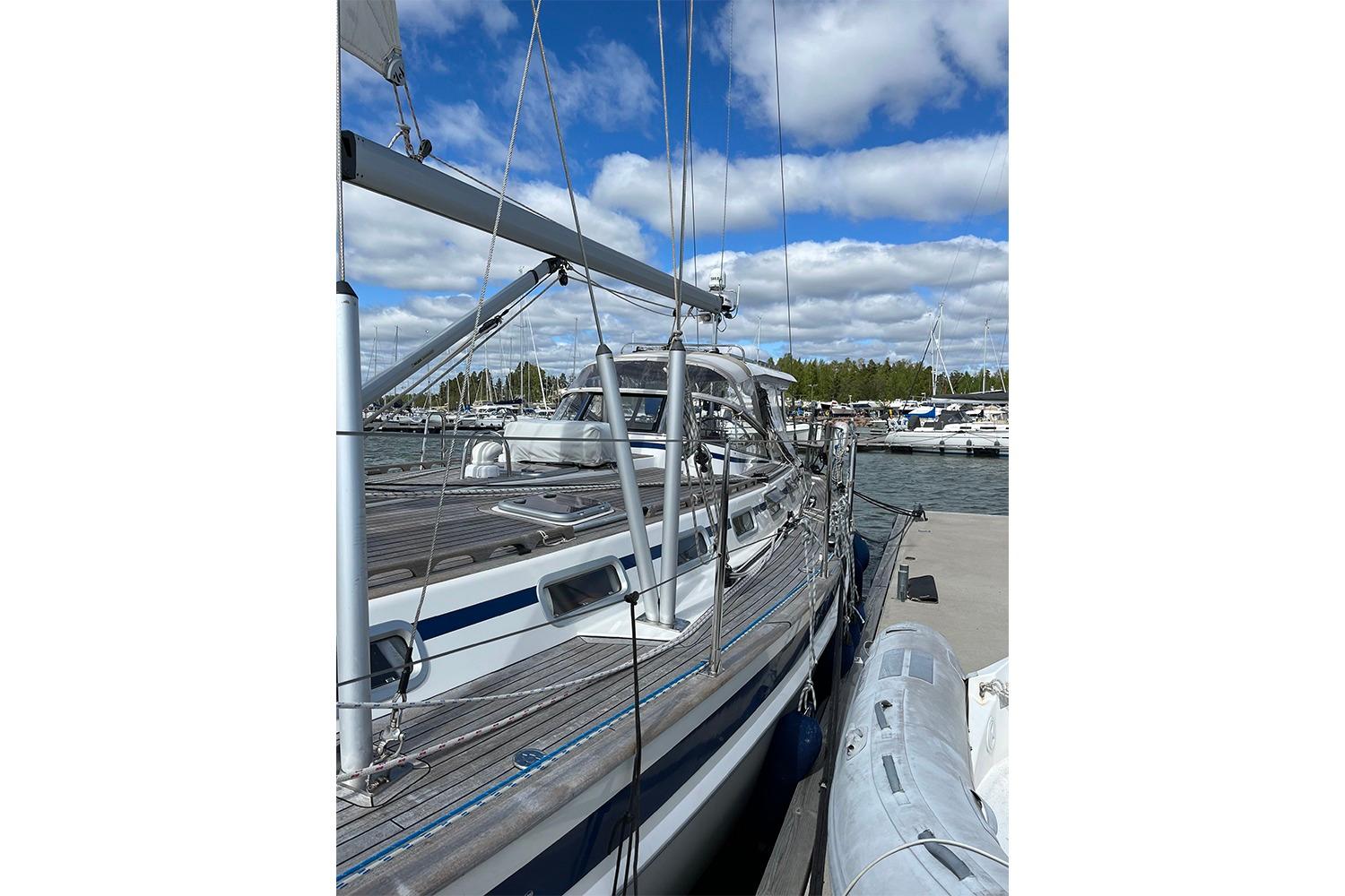 Sailboat Malo 46 Classic 2008 docked at marina under blue sky.
