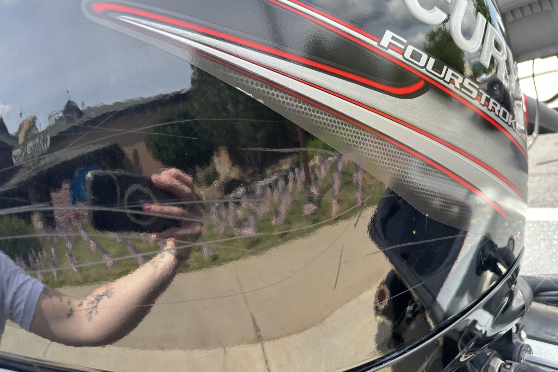 Reflection on a 2018 Ranger Z518 boat's glossy surface with visible branding.