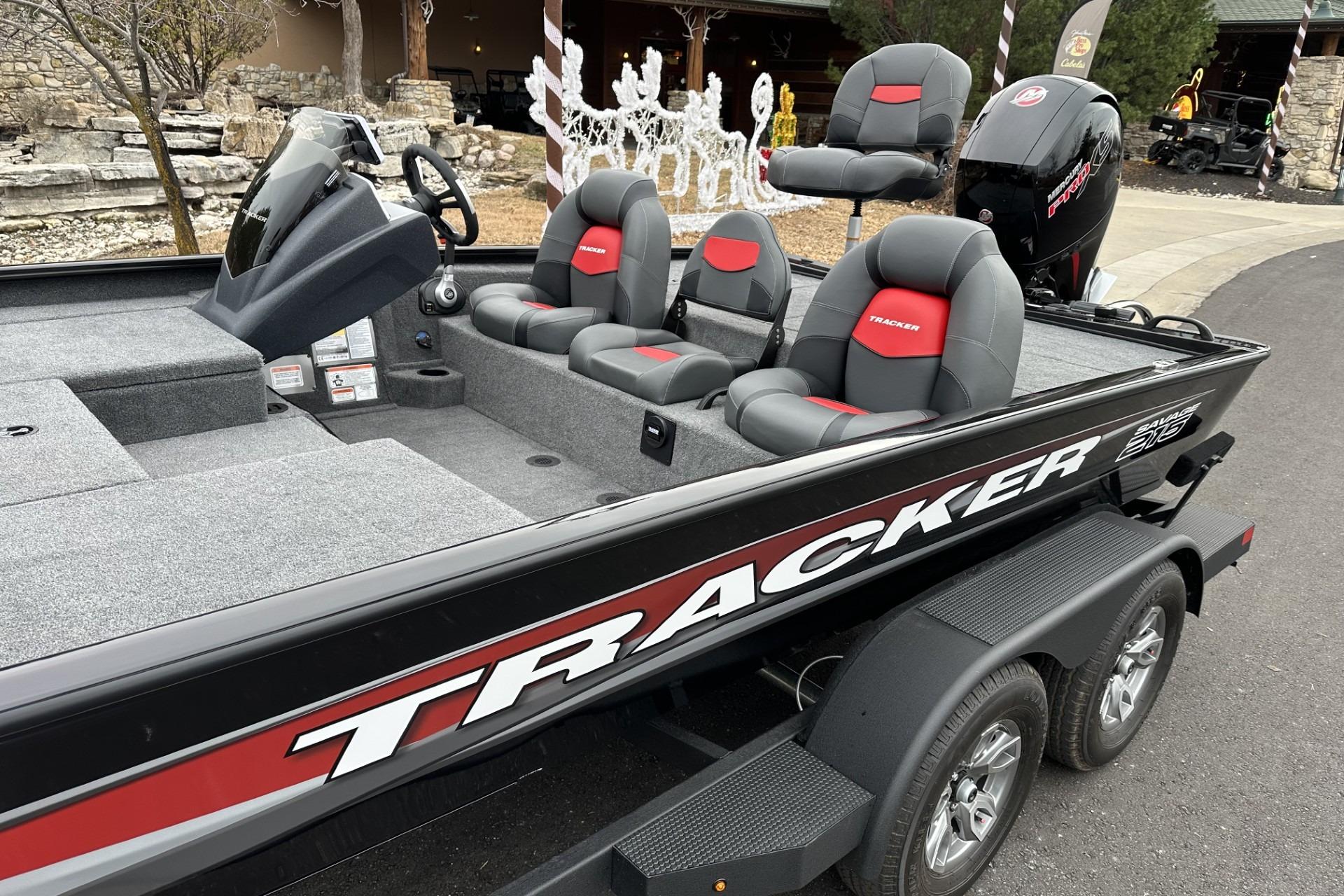 2025 Tracker Savage 215 boat with sleek design and comfortable seating on a trailer.