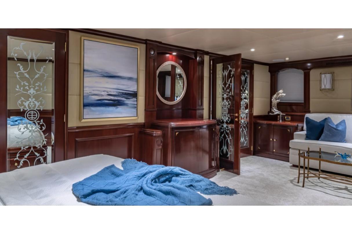 Luxurious interior of 1988 Van Mill 143 Tri-Deck Motor Yacht with elegant wood finishes.