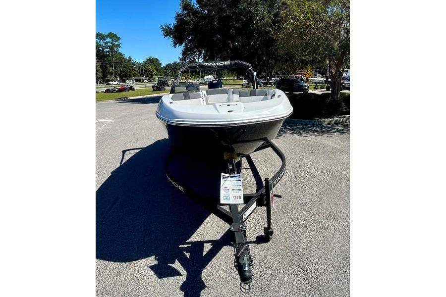 2025 Tahoe T18 boat on trailer in parking lot, sunny day.