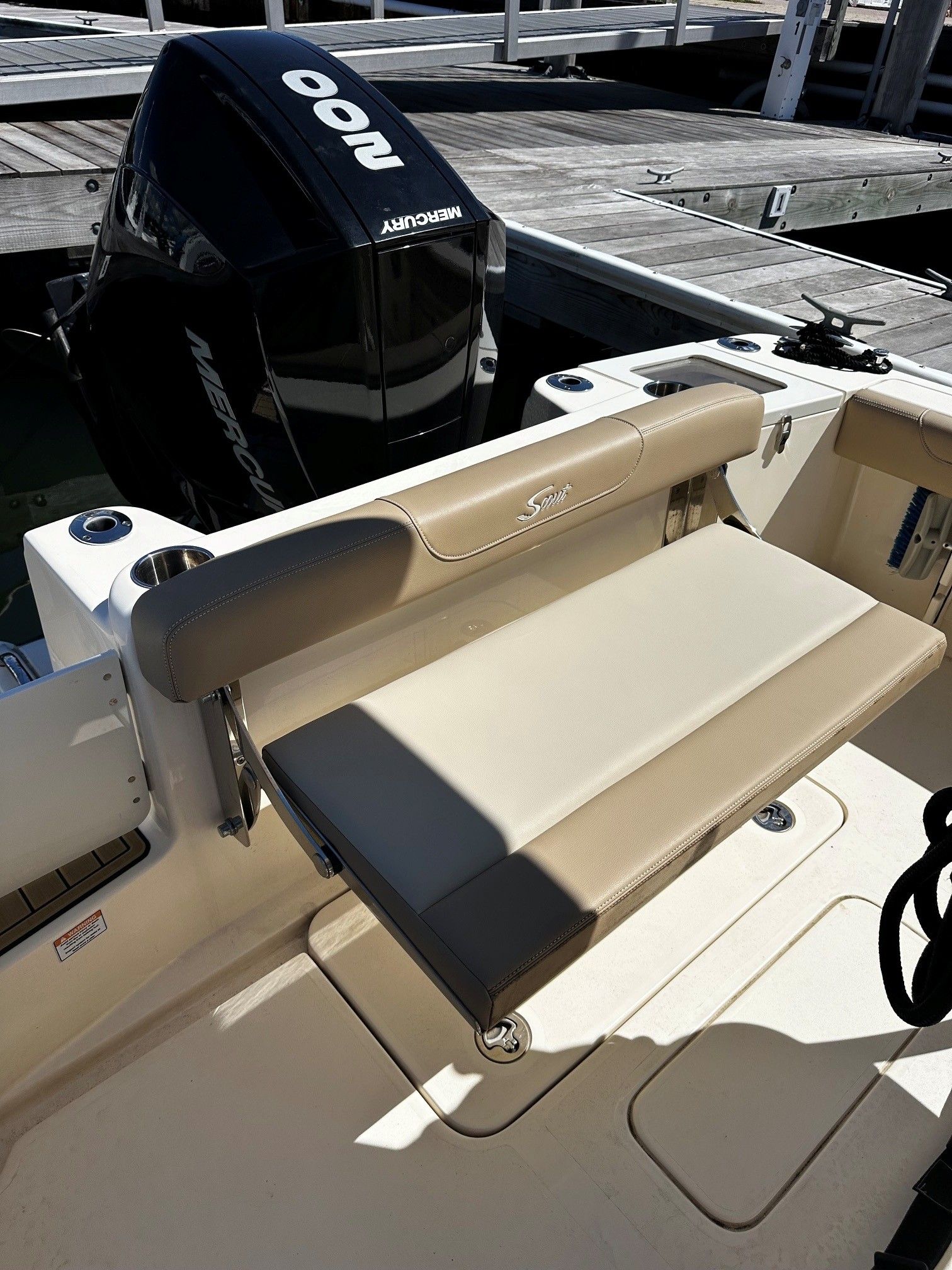 Scout 210XSF 2022 boat with Mercury engine at dock.