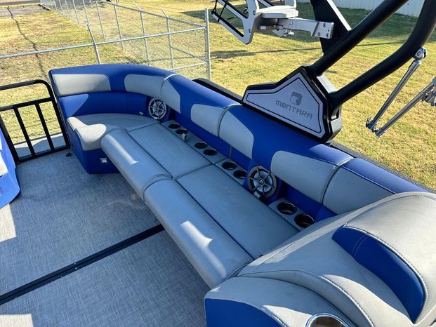 Interior of 2023 Montara 25' SURF BOSS 2.0 with blue seating.