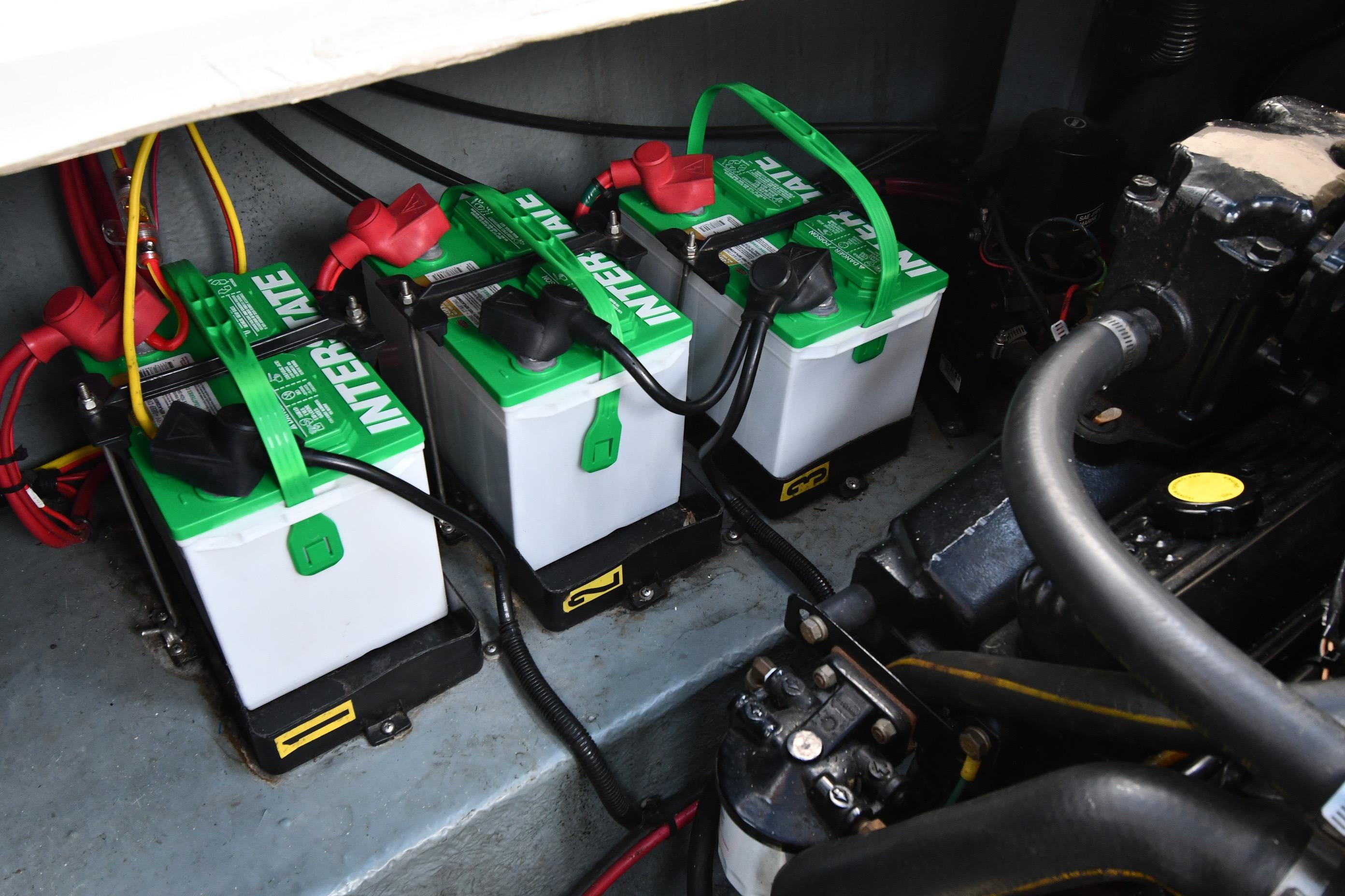 Three Interstate batteries in a 1993 Sea Ray 300 Sundancer engine compartment.