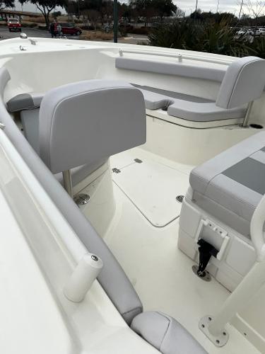 2024 Mako 214 CC boat interior with gray seating and white deck.