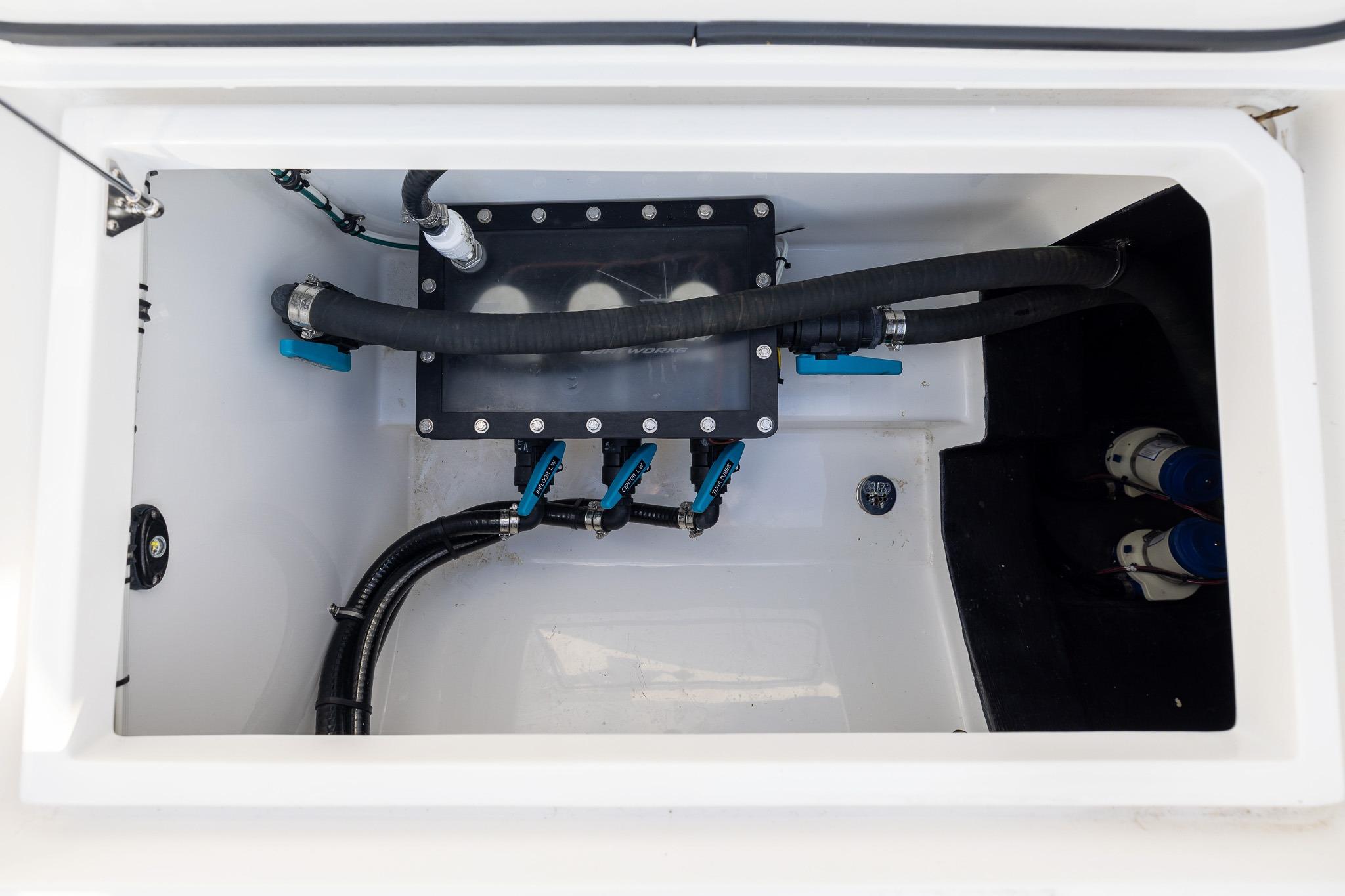 Bilge compartment of 2026 Front Runner 37 Catamaran with hoses and fittings.