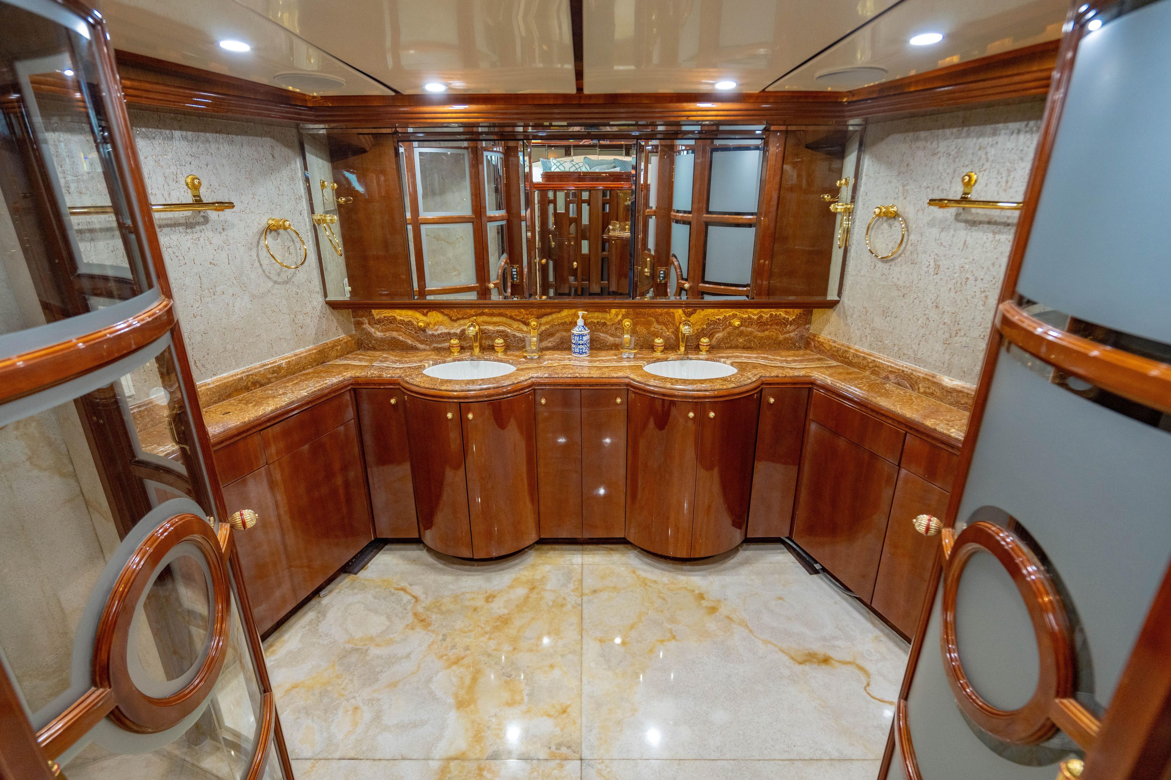 Luxurious bathroom on 2000 Destiny Flybridge Motor Yacht with elegant wood and marble finishes.