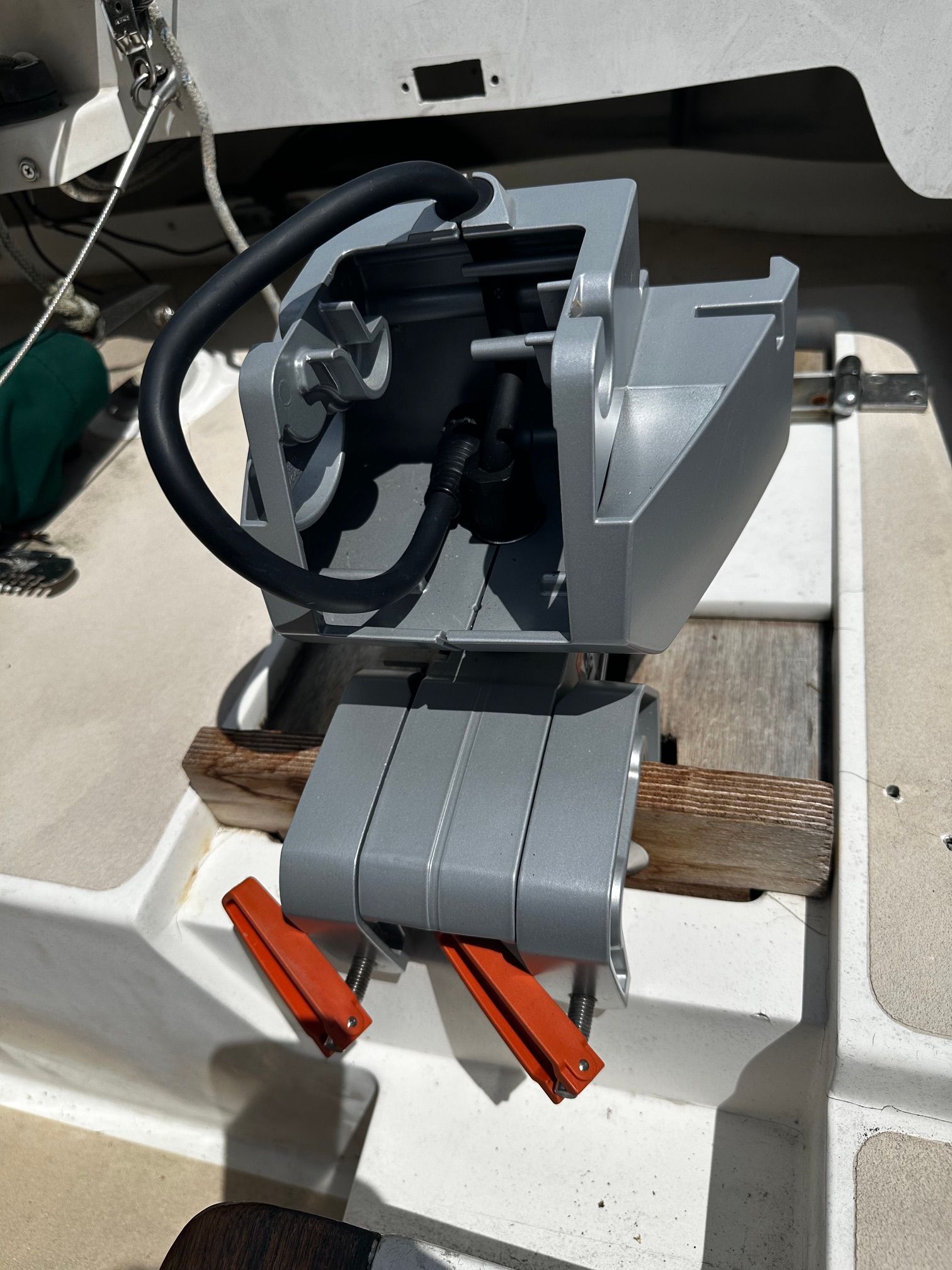 Close-up of a boat motor in the cockpit of a 1997 Alerion Express 20.