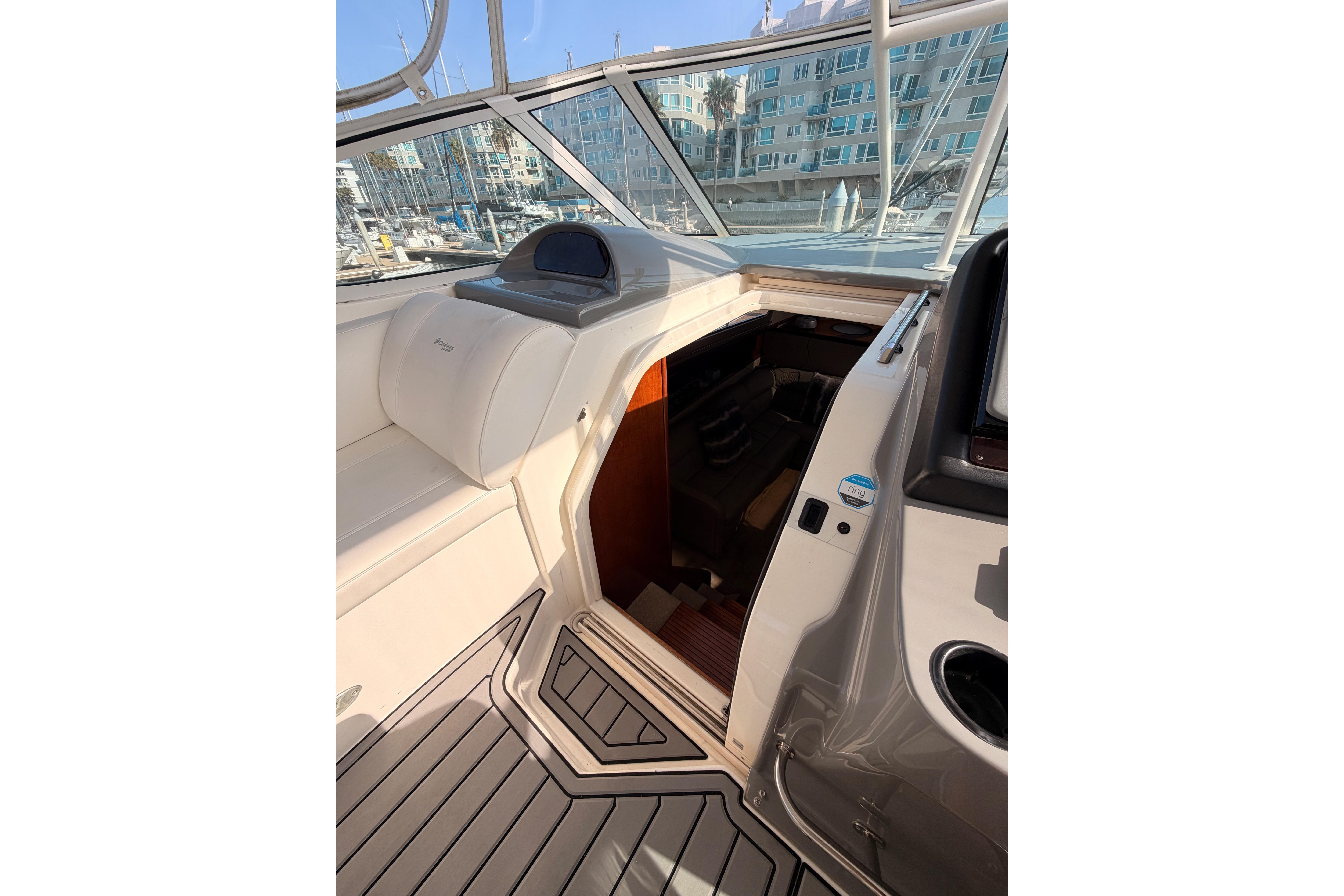 2005 Cruisers Yachts 405 Express Motoryacht interior with open cabin door.