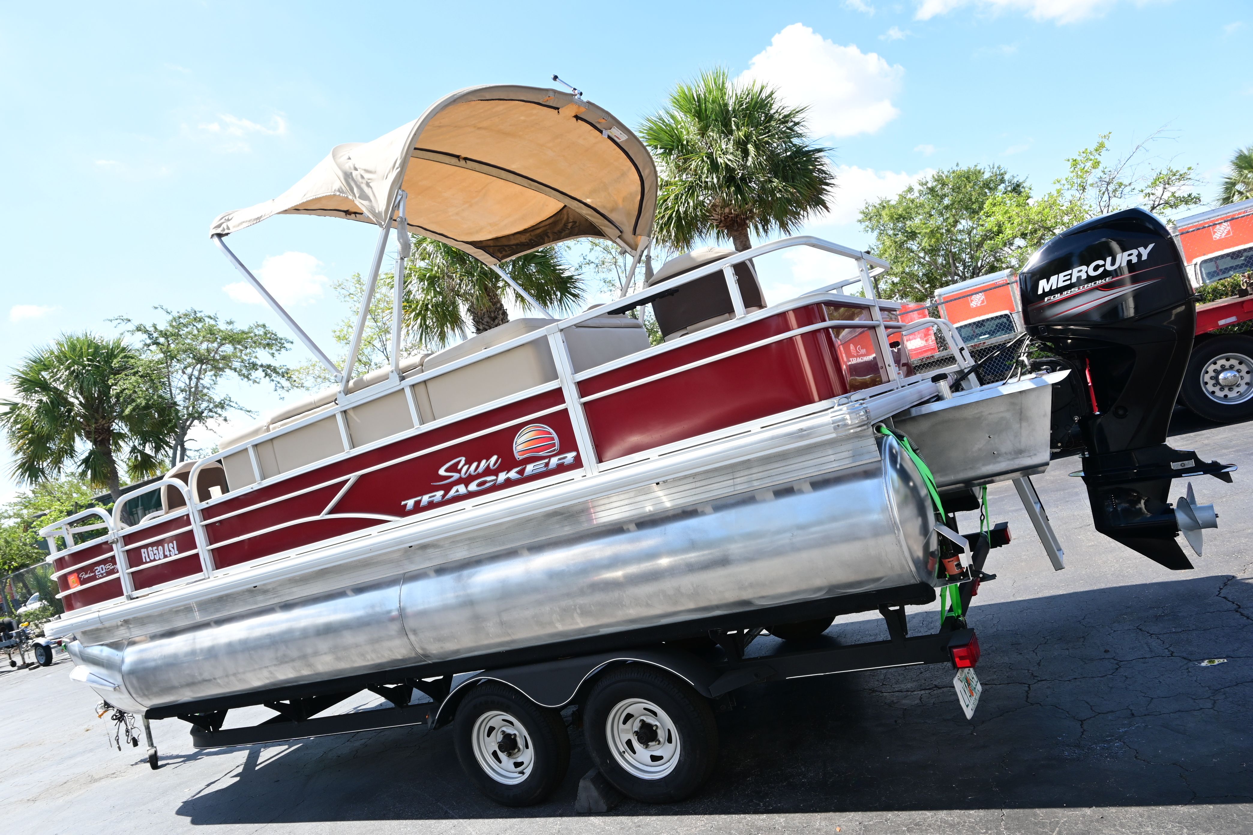 2019 Sun Tracker FISHI pontoon boat with Mercury engine on trailer.