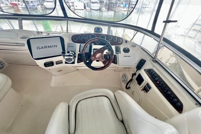 Helm of 2007 Meridian 368 Motoryacht with Garmin navigation system and luxurious seating.