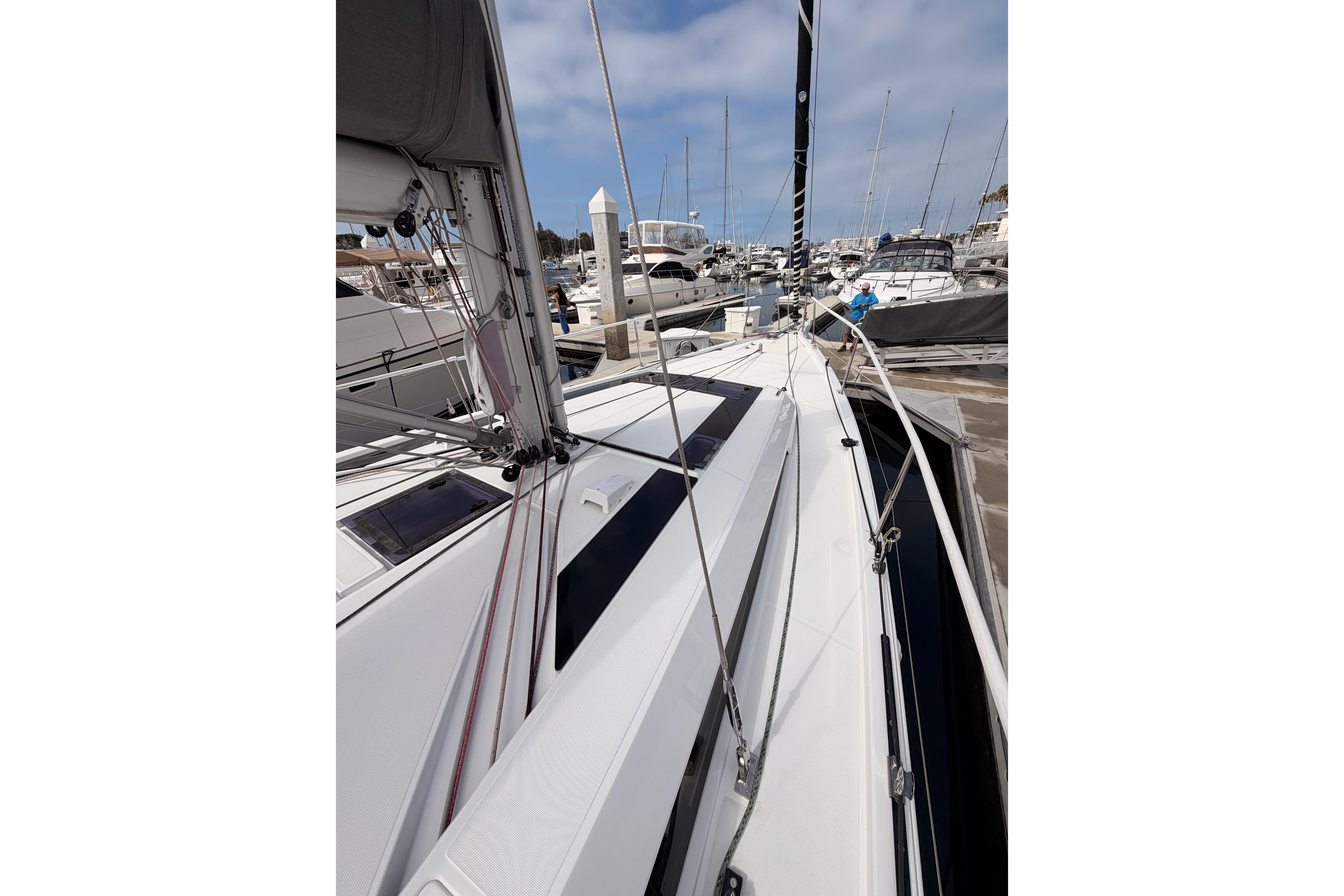 2020 Beneteau Oceanis 46.1 sailboat docked at marina, showcasing sleek deck design.