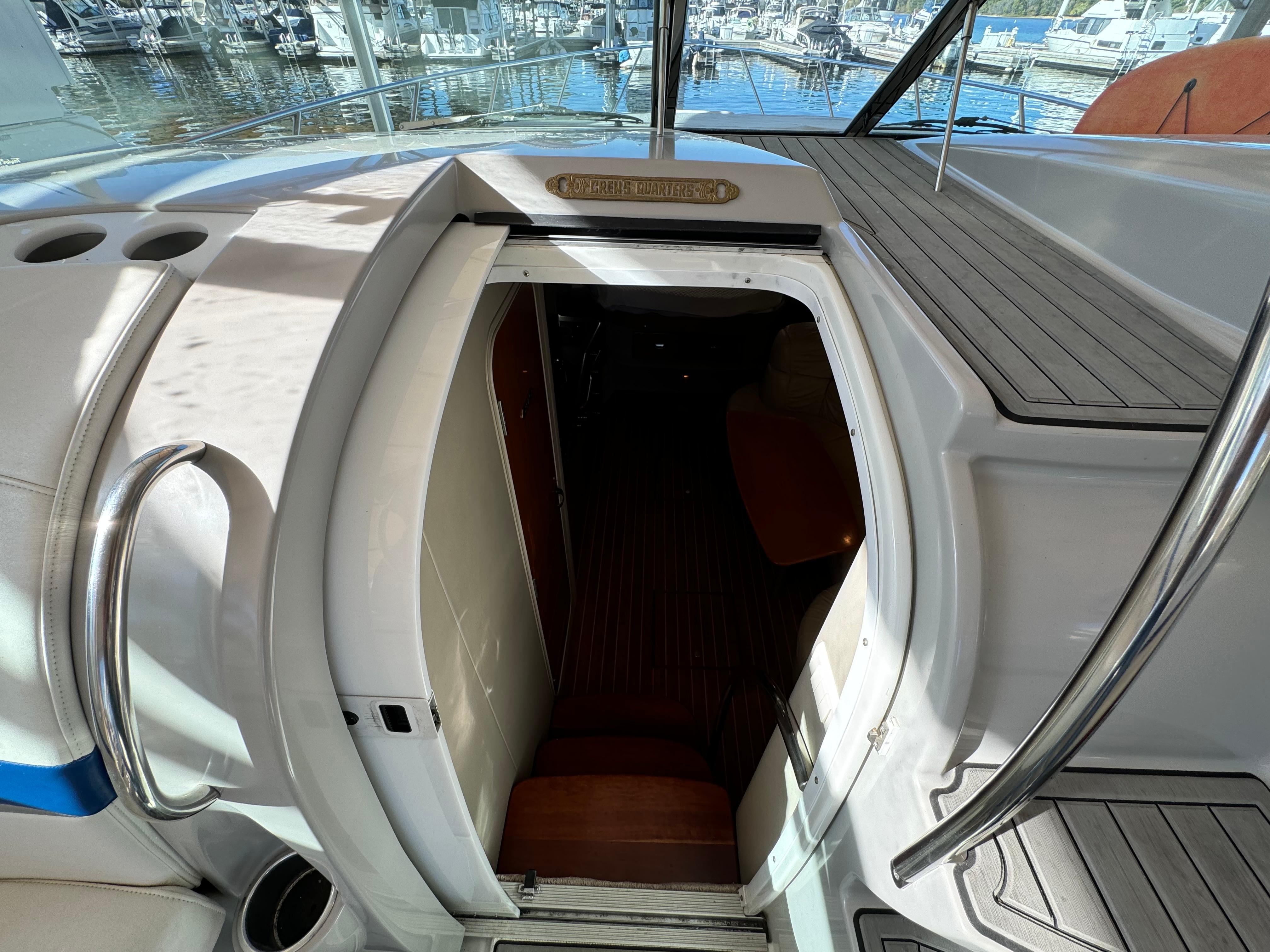 Entrance to cabin of 2004 Formula 37 Performance Cruiser, docked at marina.