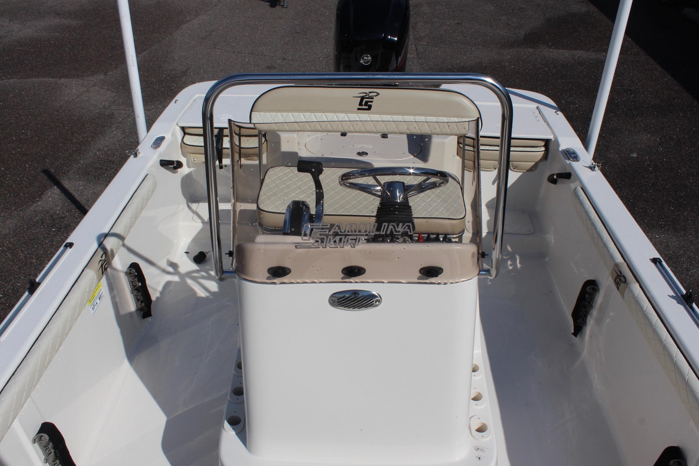 2022 Carolina Skiff 17 LS boat interior with steering console and seating.